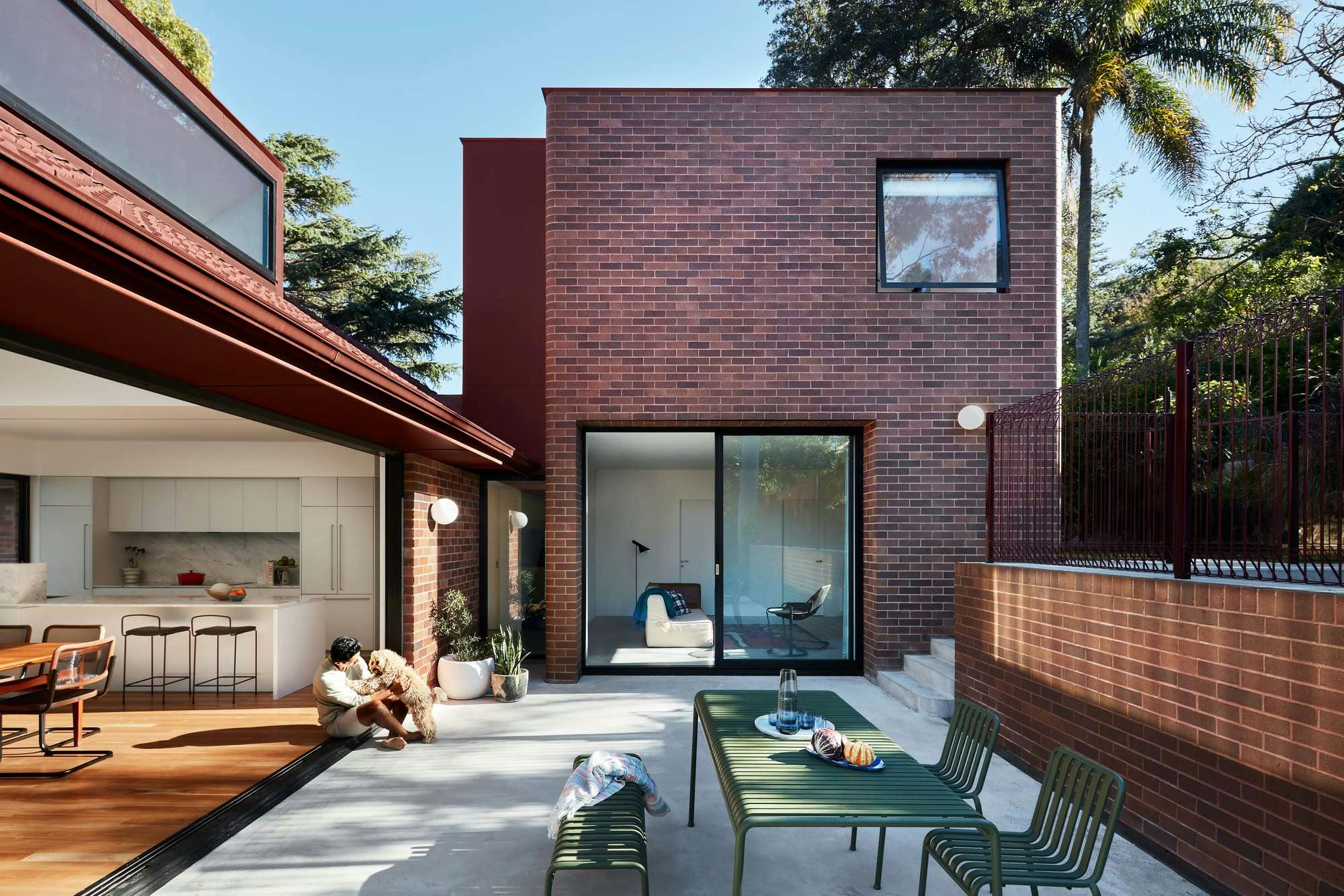 House Lincoln by Those Architects. Inner courtyard, view on living room, dining room and kitchen