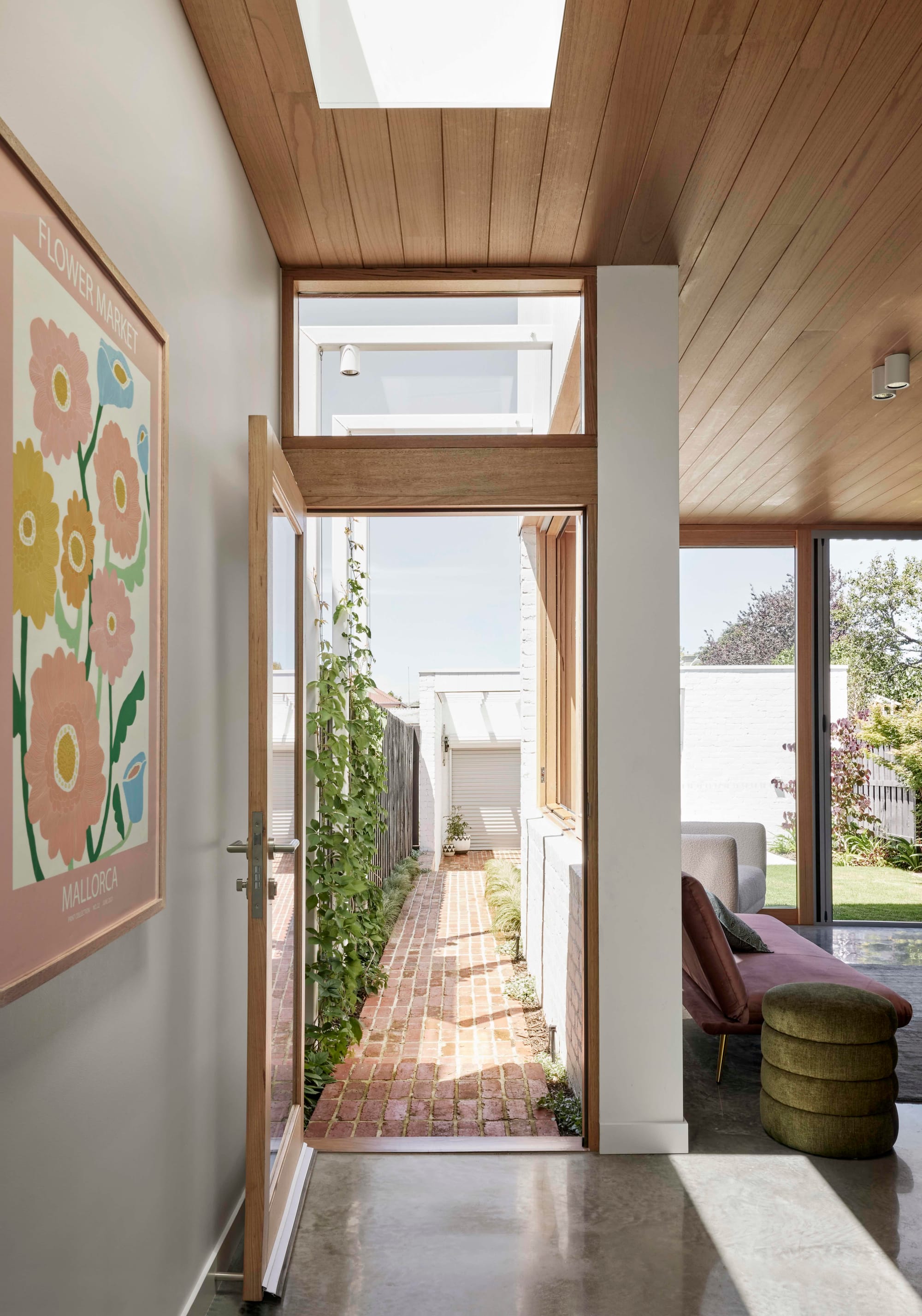 Rosie by Eckersley Architects. Photography by Tess Kelly. Doorway leading to brick footpath. 