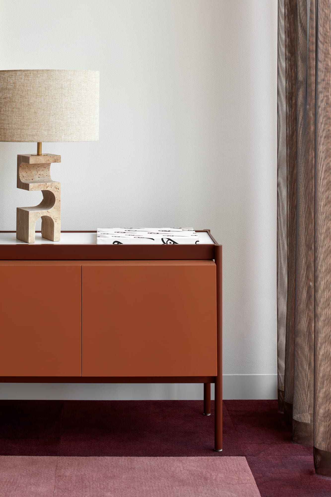 Beacon HQ by Foolscap Studio. Detail shot brown wood and metal cabinet with transparent floor to ceiling curtain.