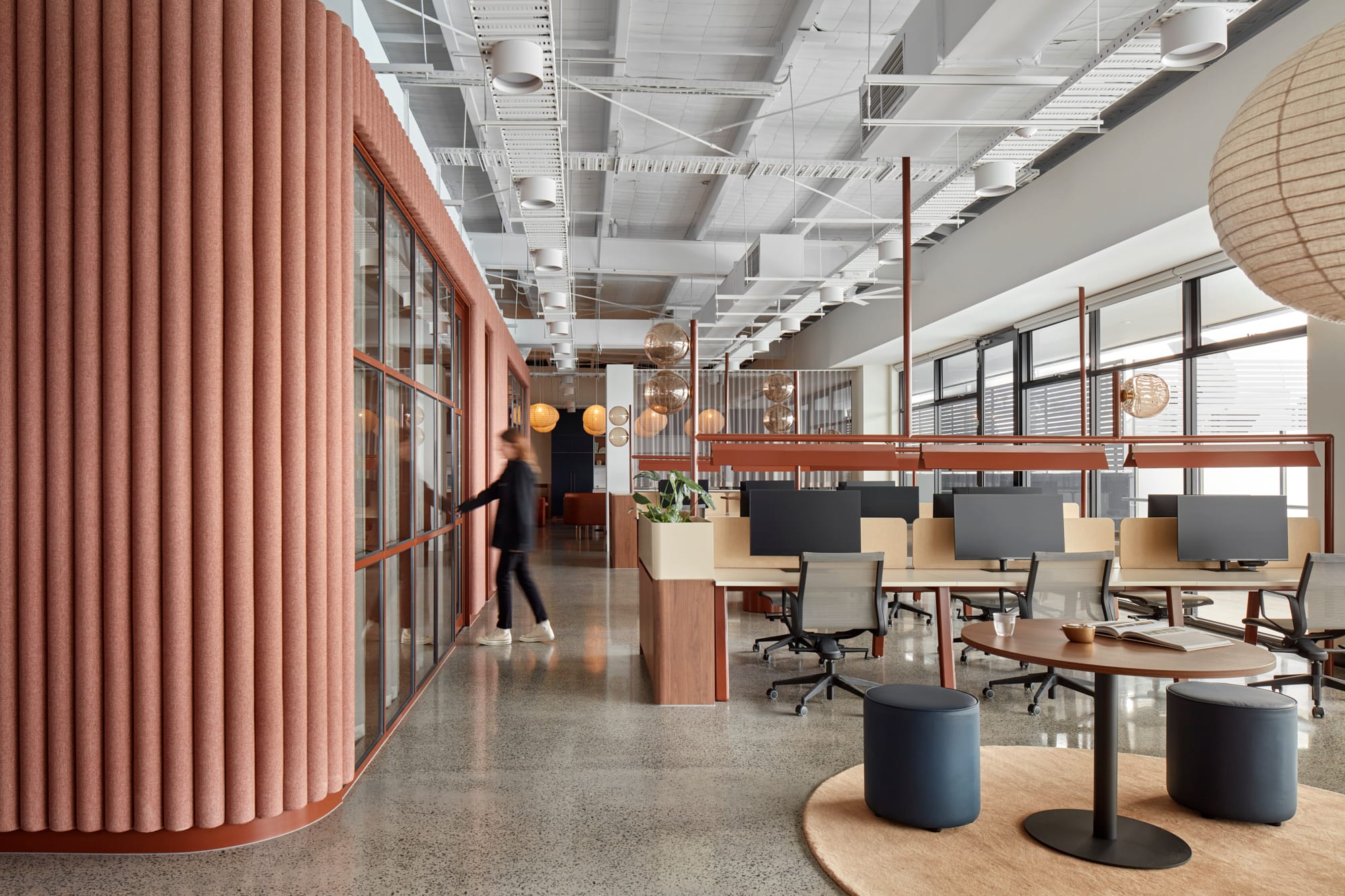 Beacon HQ by Foolscap Studio. Office overview featuring white ceiling raw construction optics, terrazzo and wooden tables.