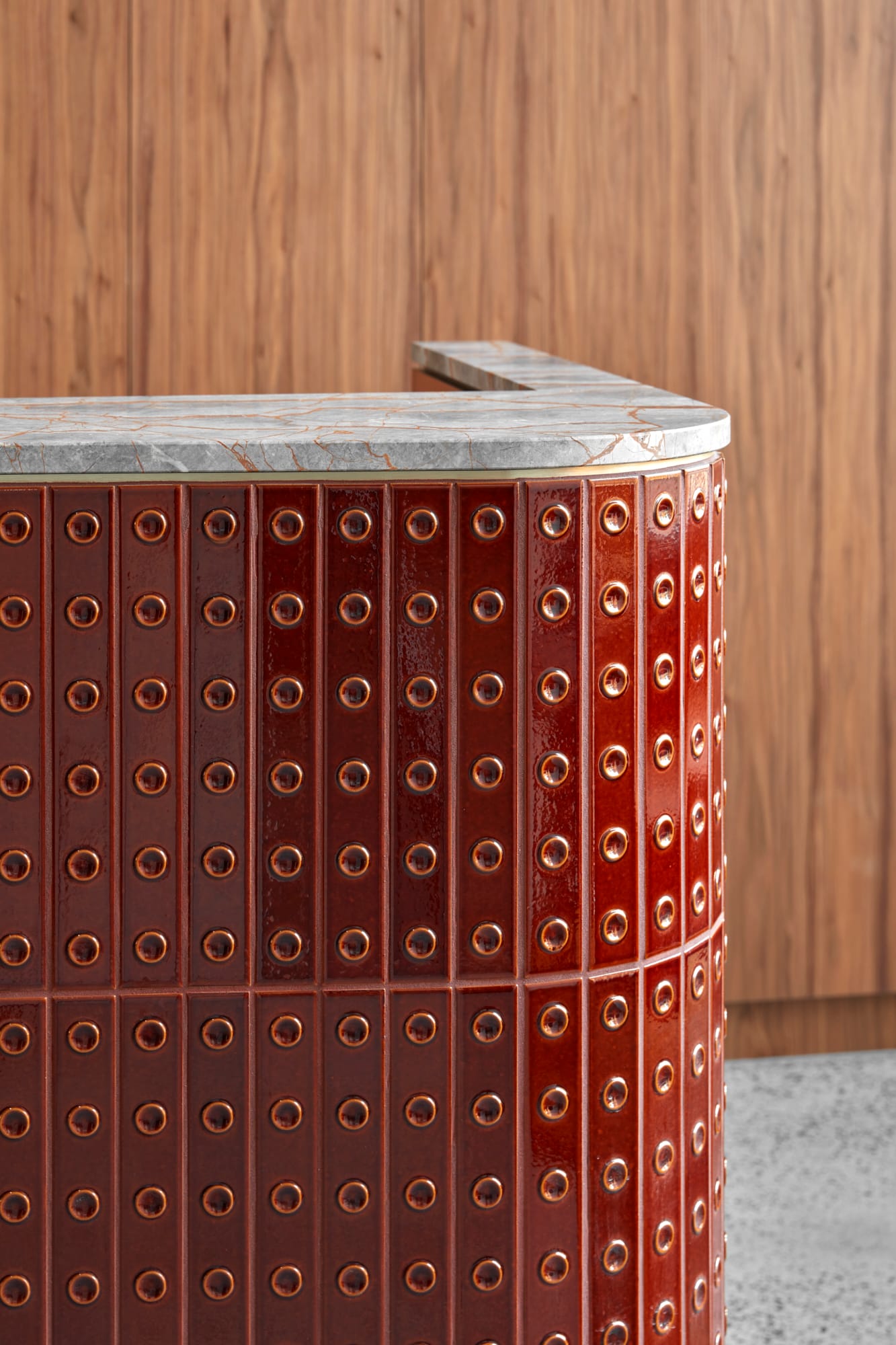 Beacon HQ by Foolscap Studio. Detail shot of tiled counter with gray marble top.