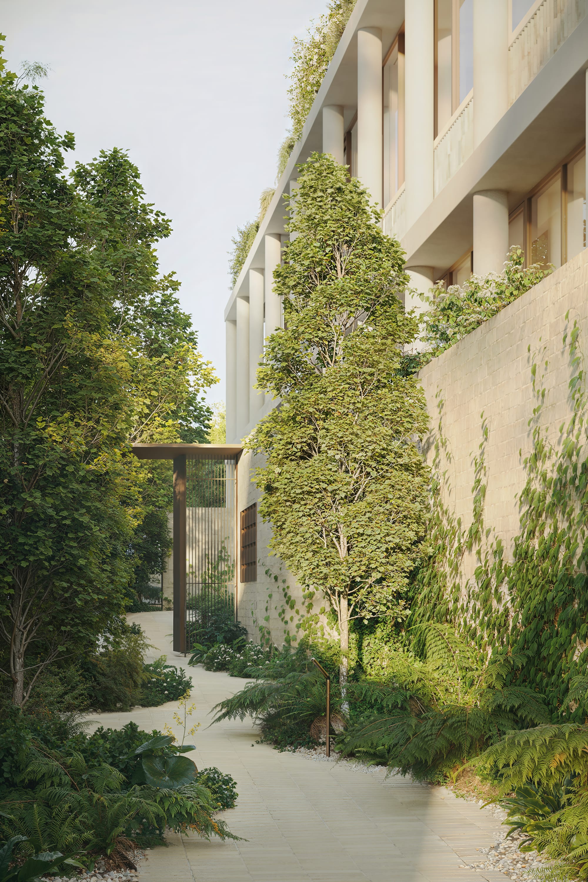 Fernhurst by ANGLE. Garden with view on cement brick facade and green roof.