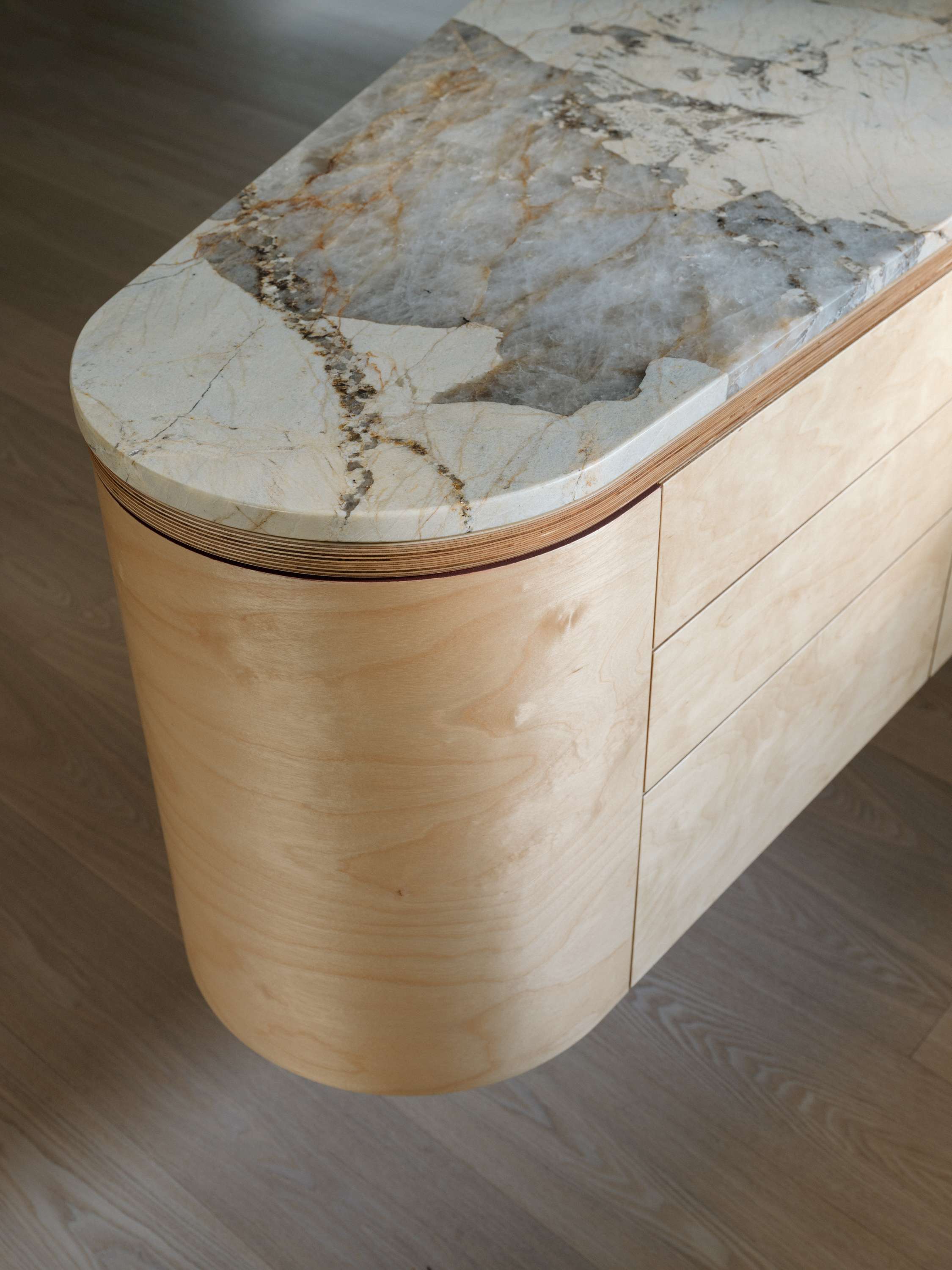 Kirribilli Downsize Apartment by Amandine & Simonetti Architecture. Customised floating kitchen island with bent plywood and marble work top.