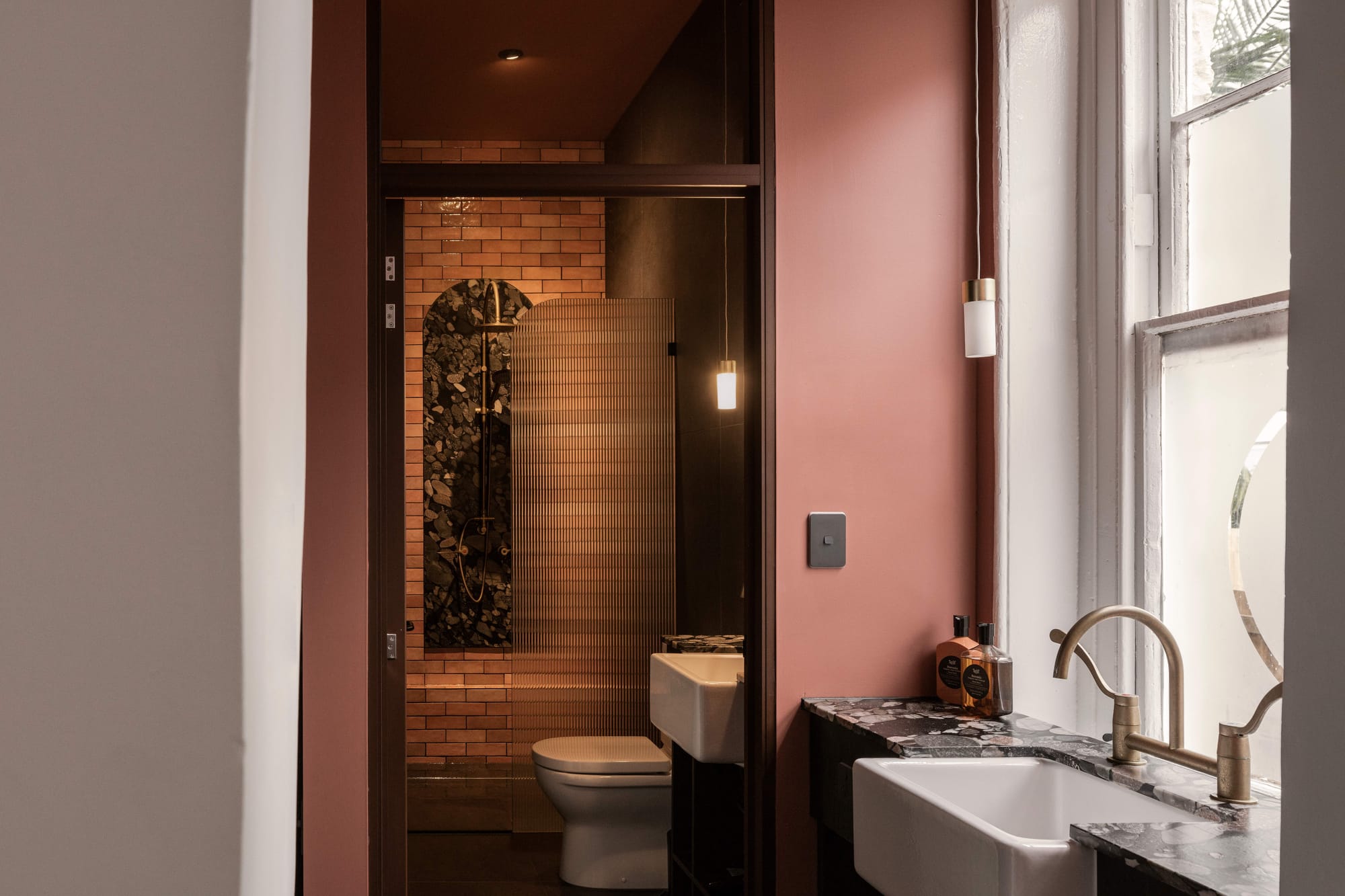 An interior shot of Miss Midgleys showing the renovated hotel bathrooms with pink accents