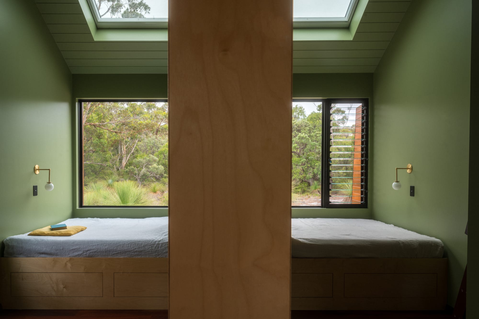 Nullaki House by Bare Architects. Interior view to two bedrooms each with nature view.