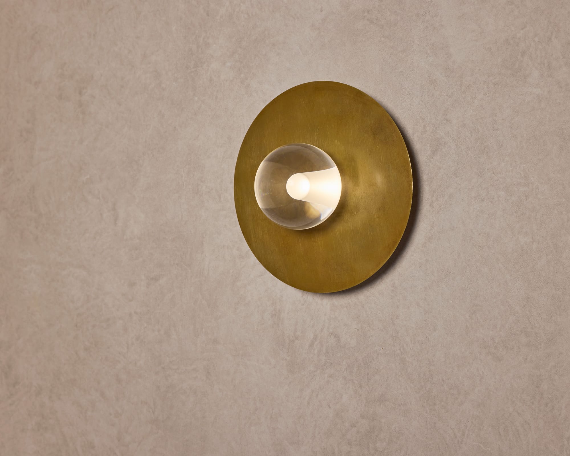 Globe Disc Wall Light by alt. Artefact. Brushed brass Globe Disc Wall Light with defused light.