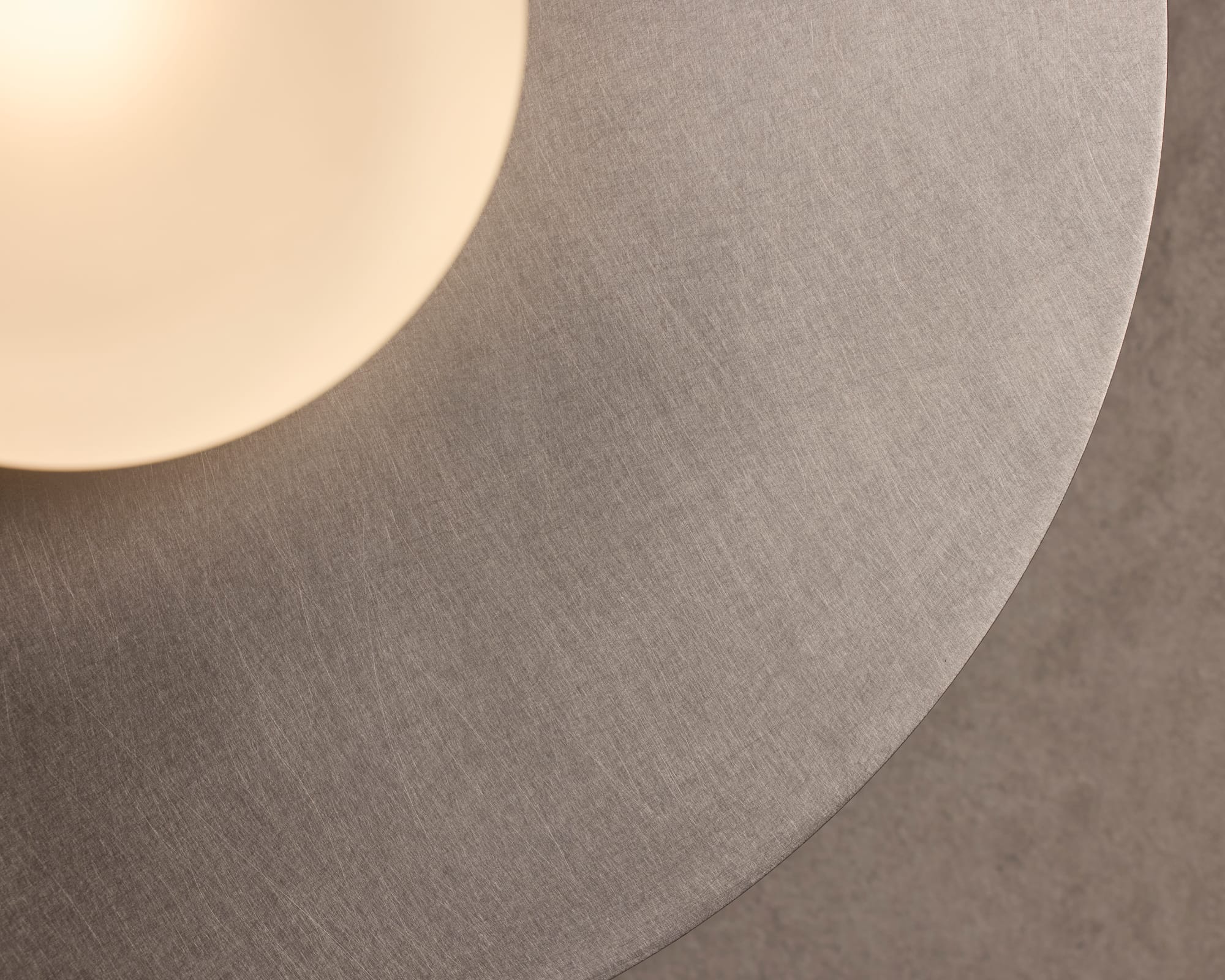 Globe Disc Wall Light by alt. Artefact. Detail of silver brushed Globe Disc Wall Light.