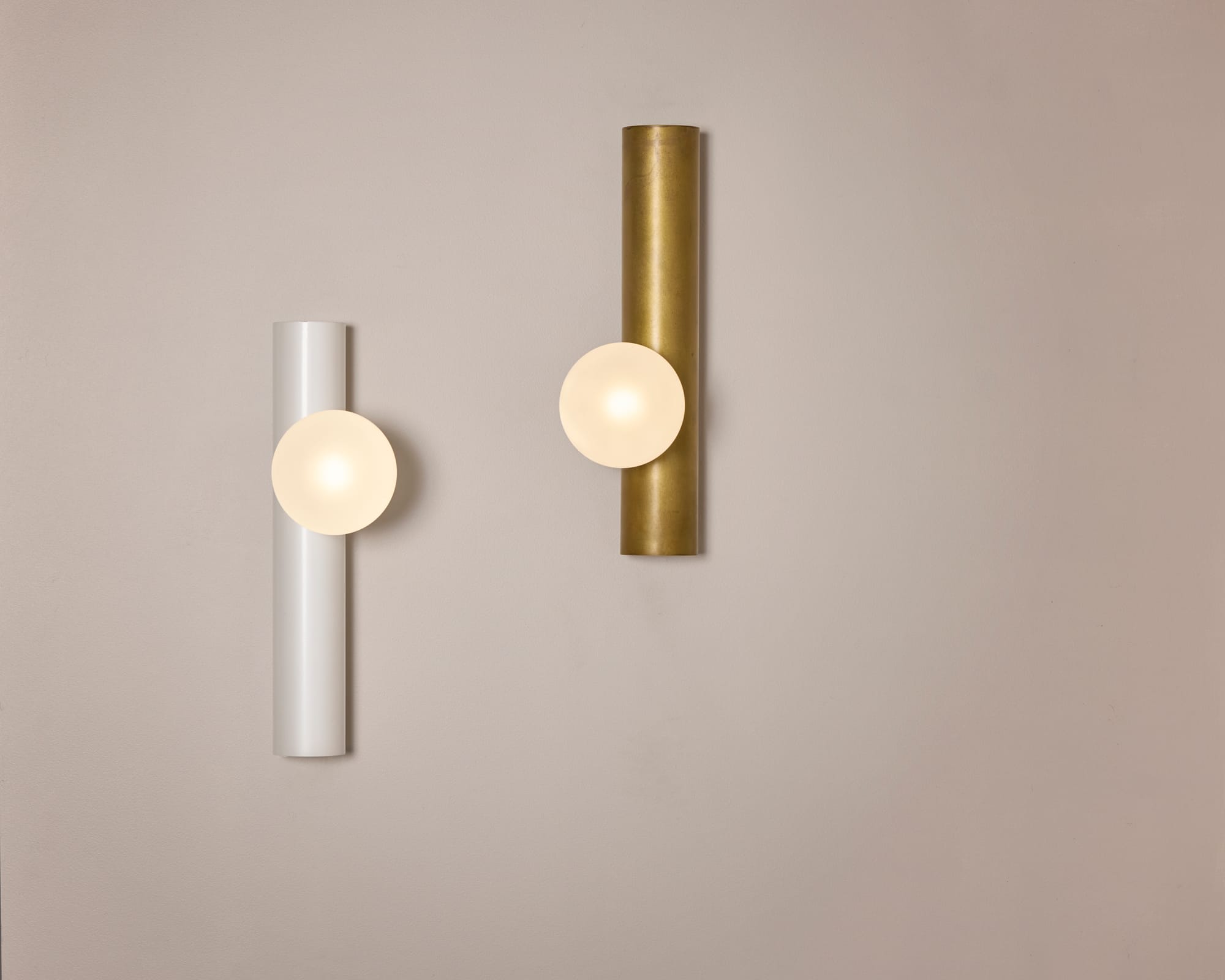 Globe Tube Wall Light by alt. Artefact. White powder coated and brushed brass Globe Tube Wall Light.