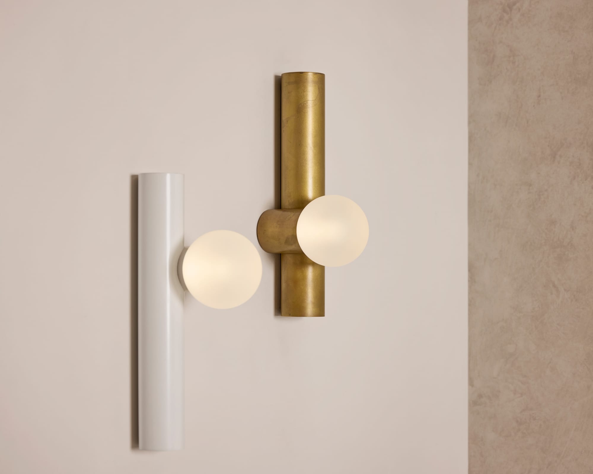 Globe Tube Wall Light by alt. Artefact. White powder coated and brushed brass Globe Tube Wall Lights.