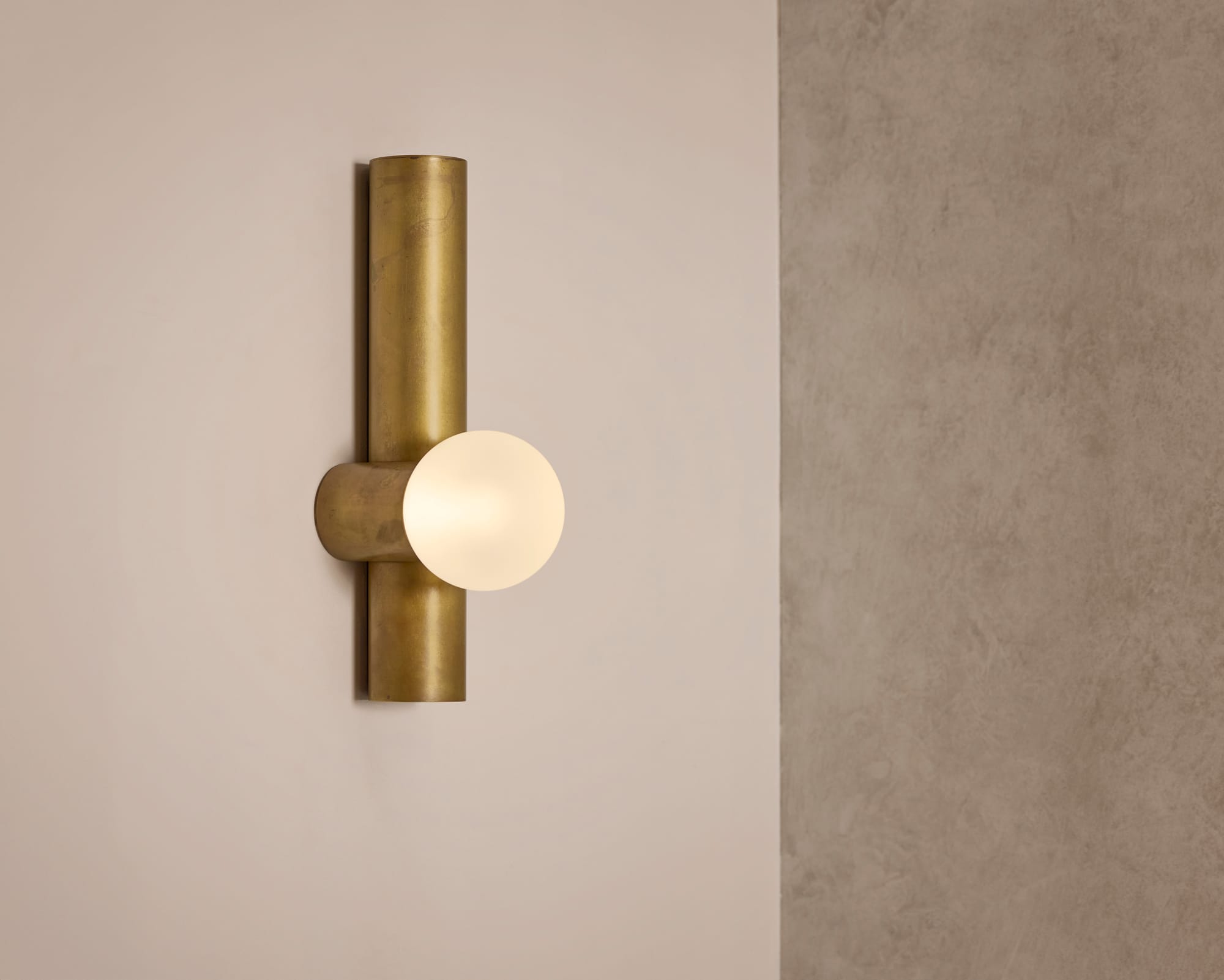 Globe Tube Wall Light by alt. Artefact. Brushed brass Globe Tube Wall Light.