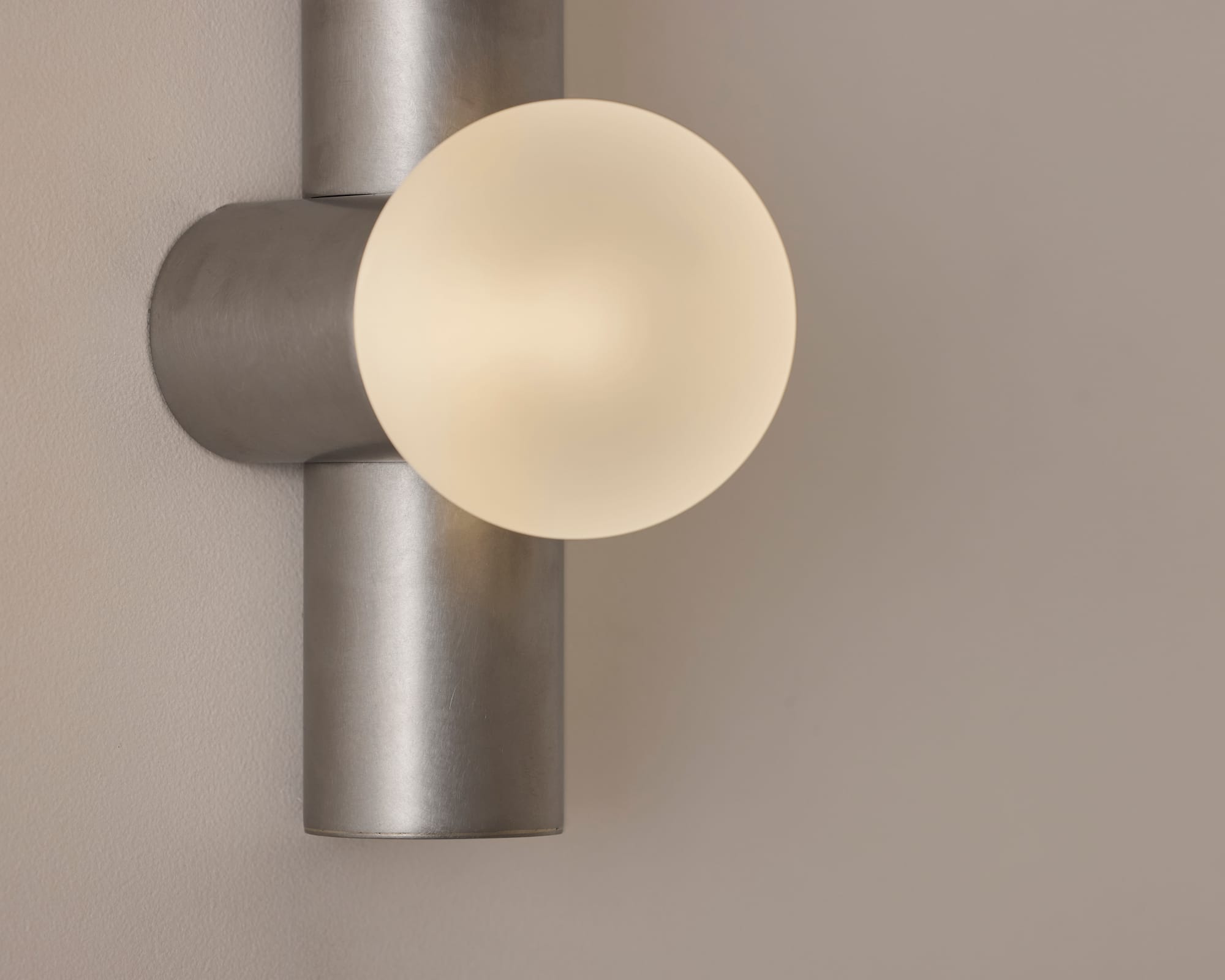 Globe Tube Wall Light by alt. Artefact. Silver brushed Globe Tube Wall Light.