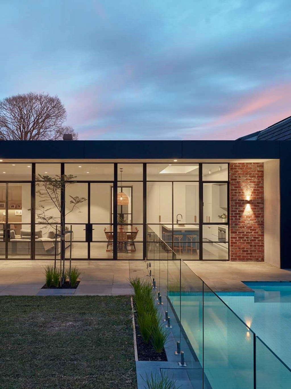 The Unbricked House by Merrylees Architecture. View from garden with pool to house, on kitchen area and living space.