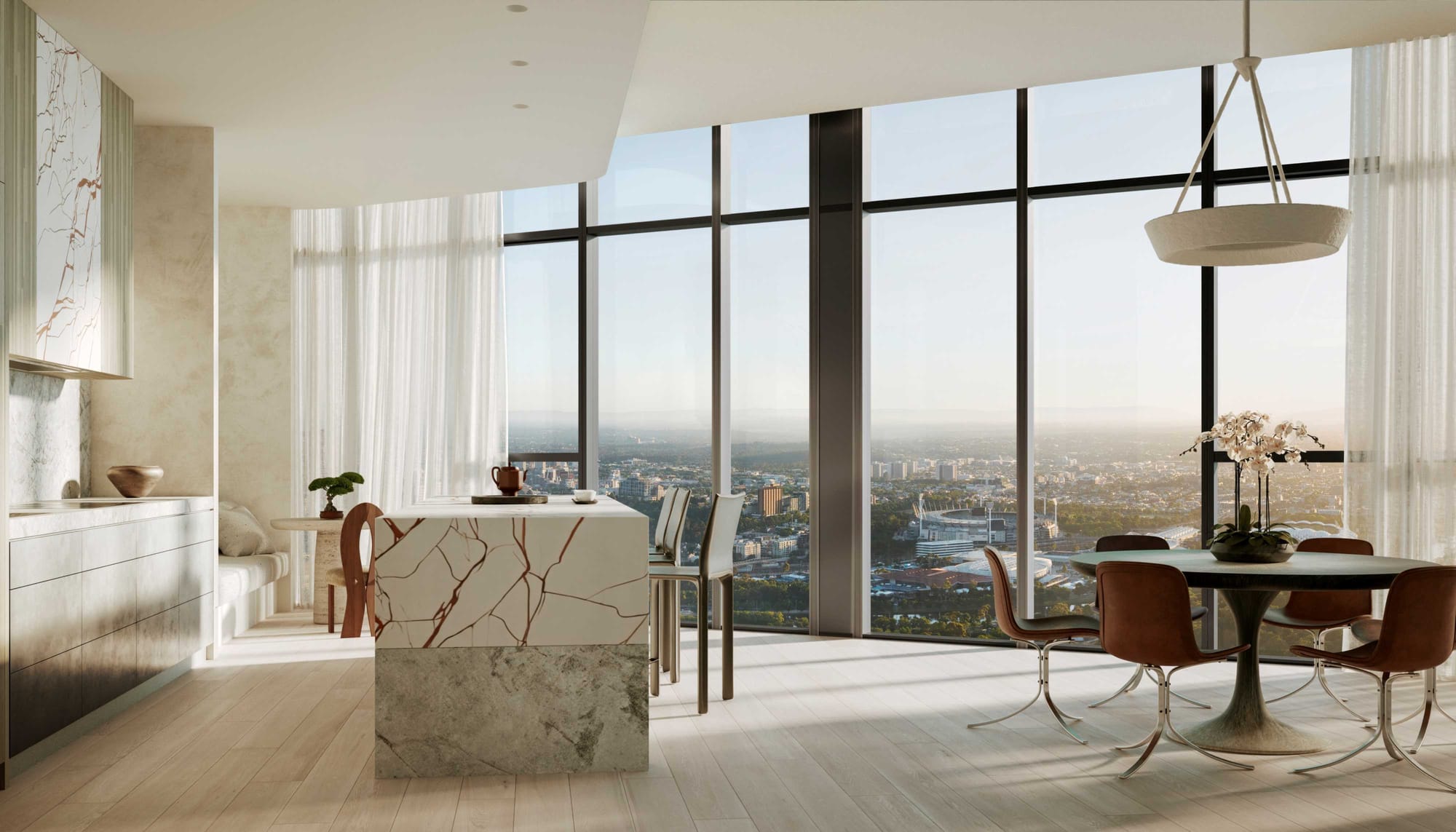 BLVD Penthouse by David Hicks. Luxury kitchen featuring marble kitchen island, seating area and floor to ceiling windows with view on Melbourne. 