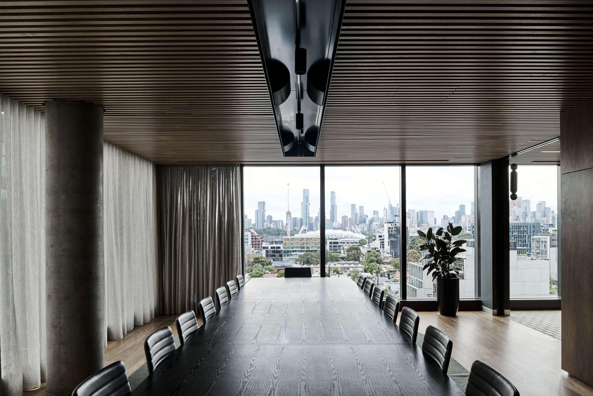 Icon HQ by FIGR. Office conference room featuring floor to ceiling windows and view to city.