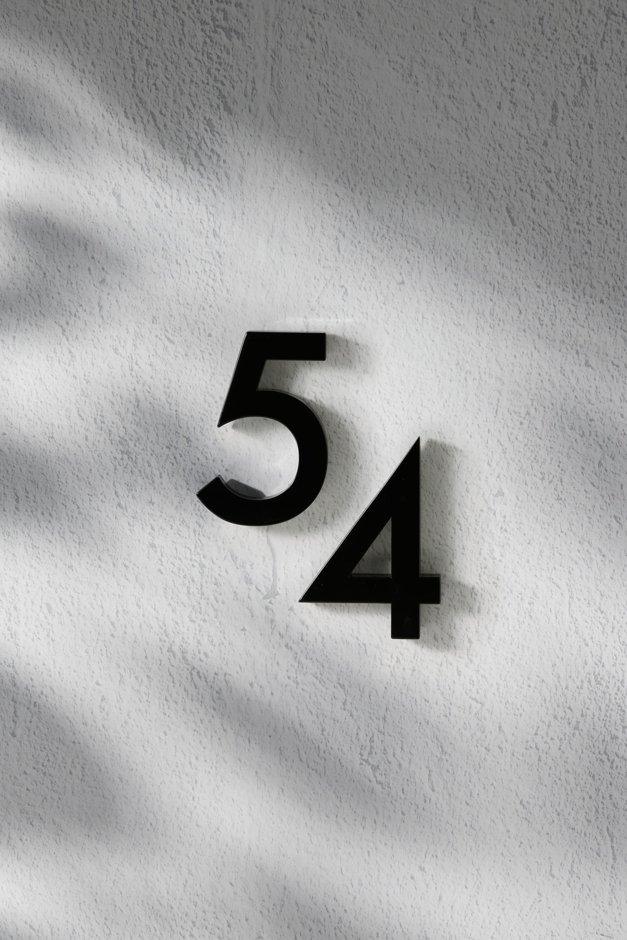 Outdoor Collection by Hibernate. Handcrafted, black powder-coated steel mountable numbers. 