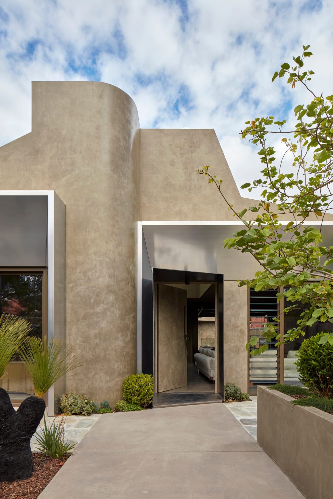 Proclamation House by State of Kin. Modern contemporary family home featuring hempcrete facade and aluminium awnings.