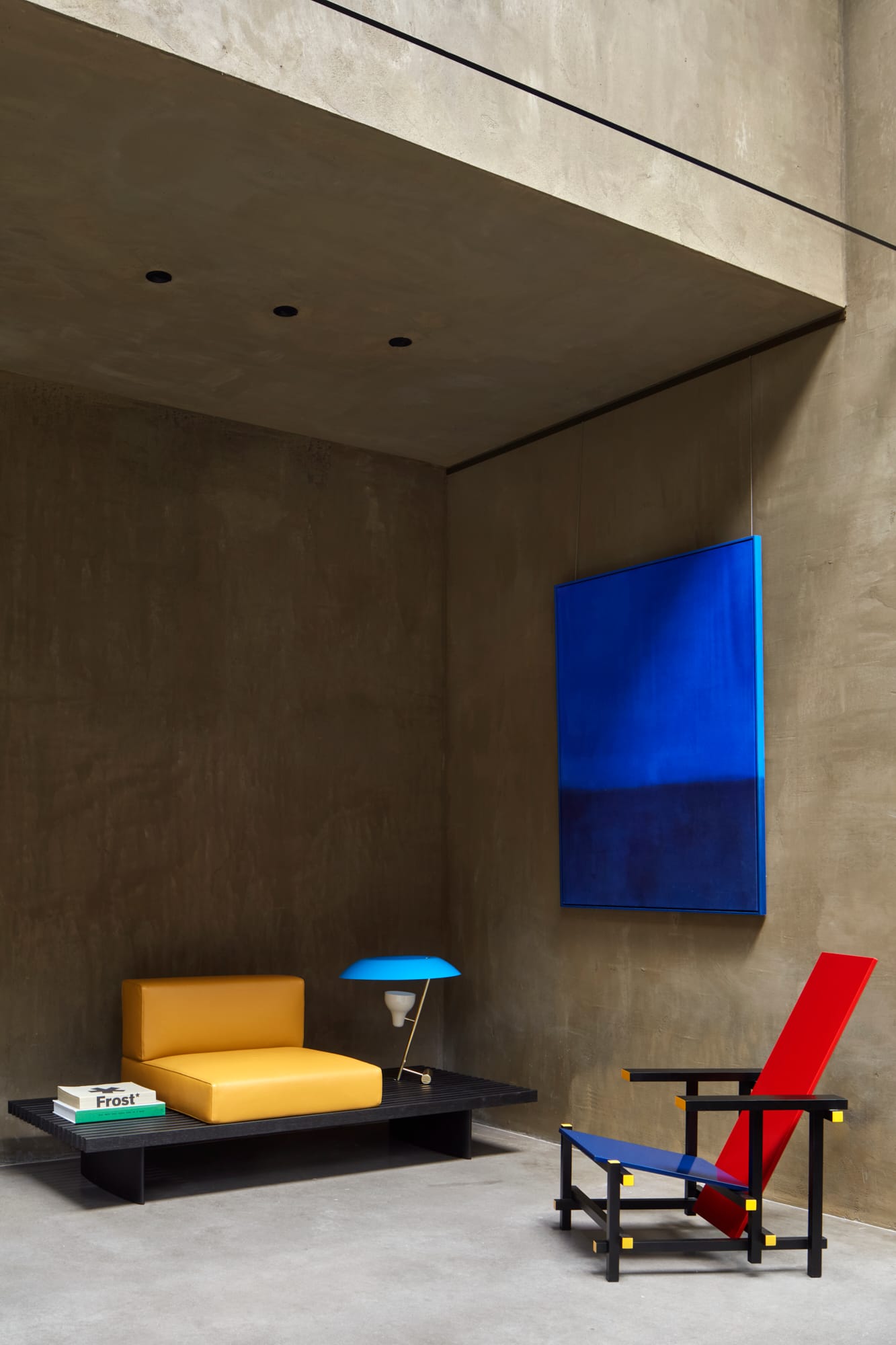 Proclamation House by State of Kin. Reading corner featuring olive-blend hemp render walls, modern colorful furniture and art.