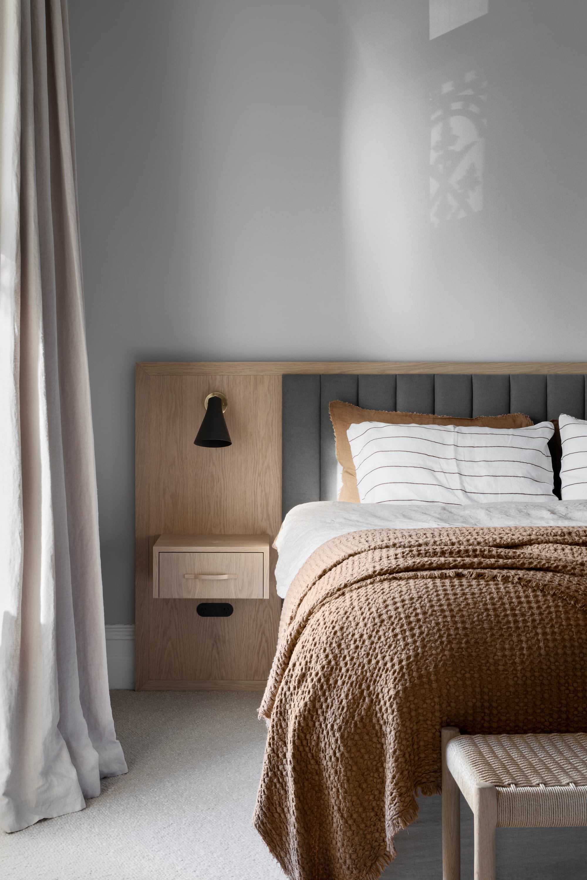 South Terrace Residence by Chan Architecture. Bedroom with wooden bespoke bed and beige linen curtain.