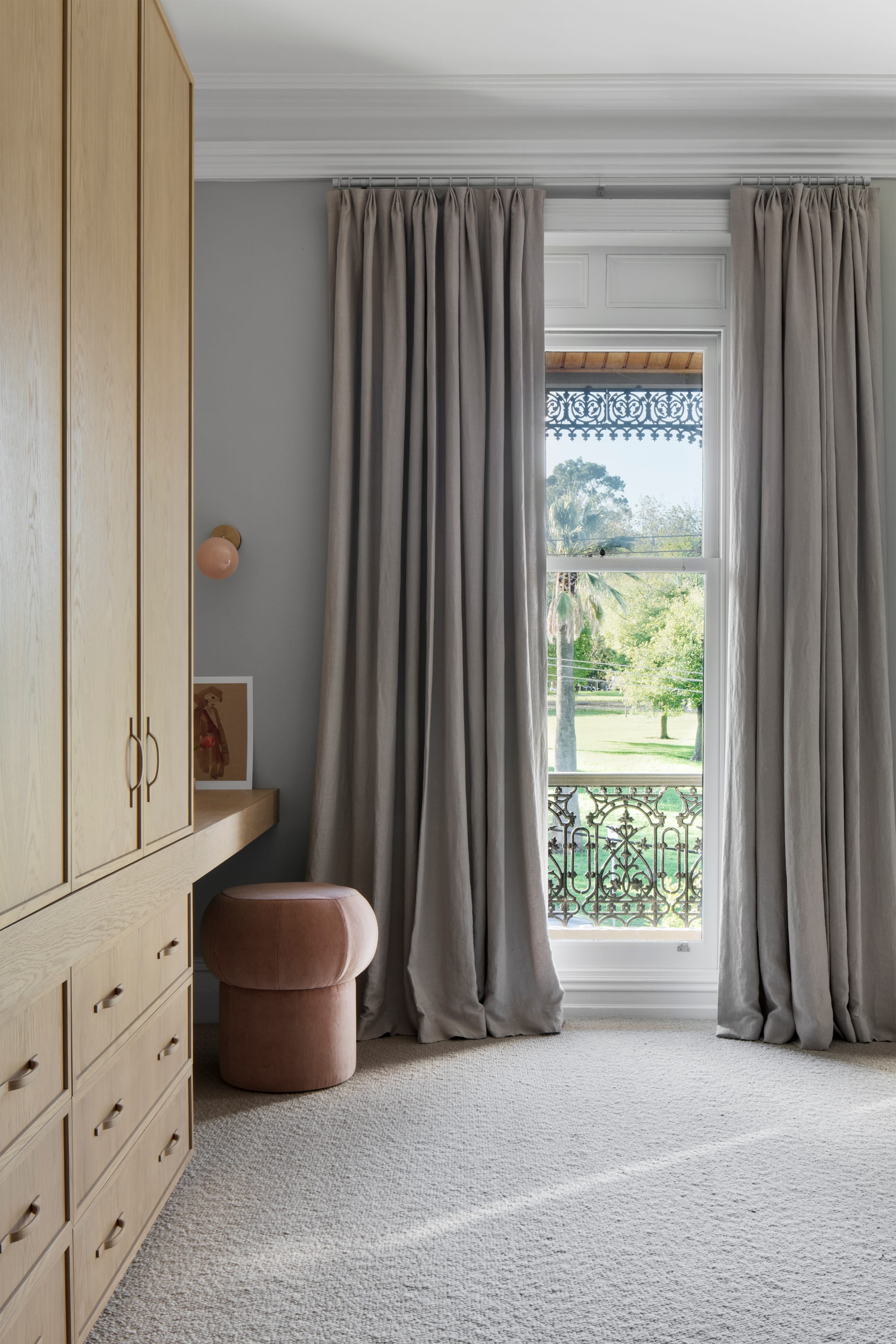 South Terrace Residence by Chan Architecture. Bed room featuring fitted, oak cabinet and view to Victorian Terrace.