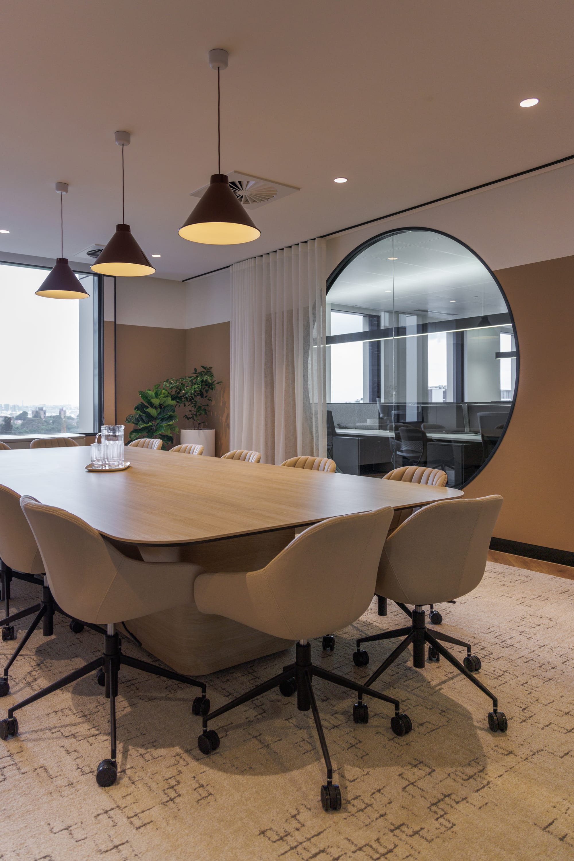 St Leonards Centuria Office Fit-Out by Alinea. Water dispenser detail of round shaped bar featuring customised shelving.