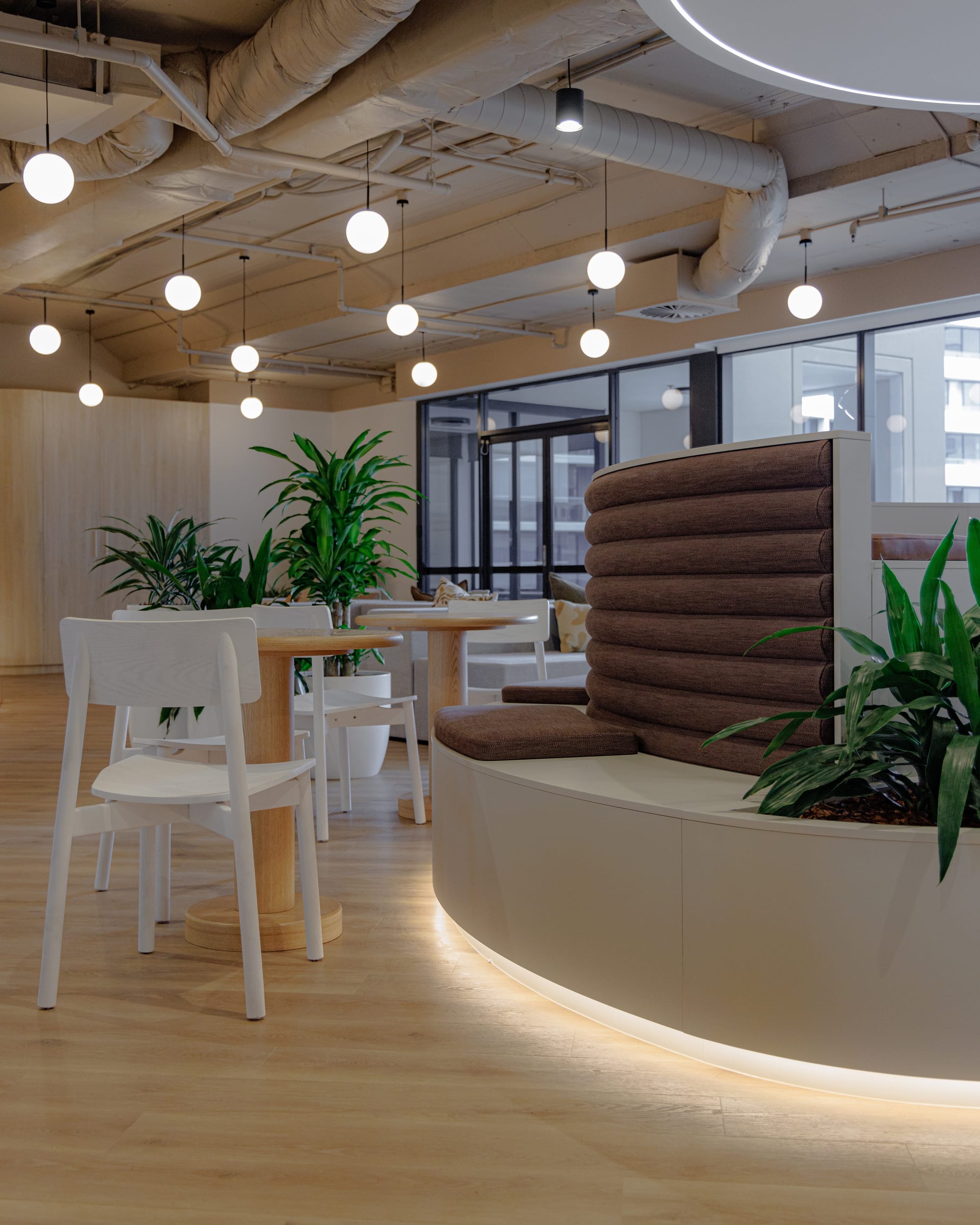 St Leonards Centuria Office Fit-Out by Alinea. Office lunch room featuring customised, round shaped seating island.