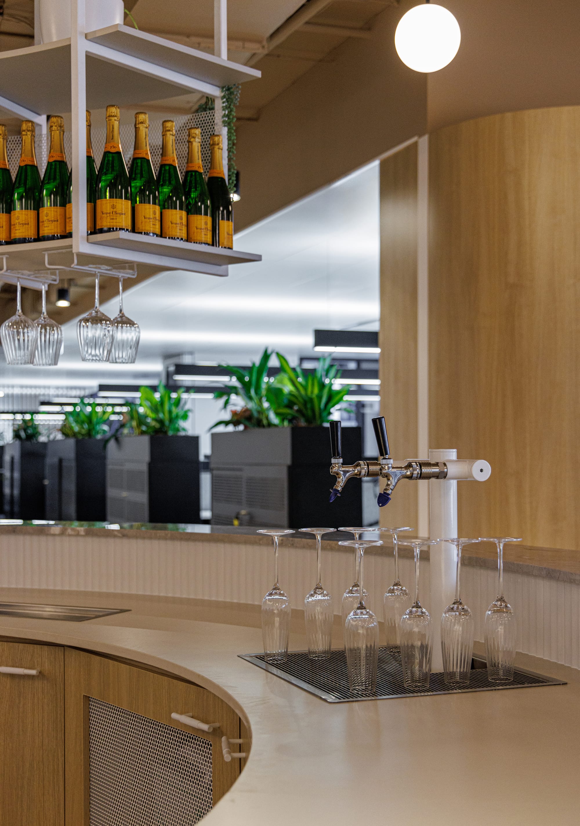 St Leonards Centuria Office Fit-Out by Alinea. Water dispenser detail of round shaped bar featuring customised shelving.