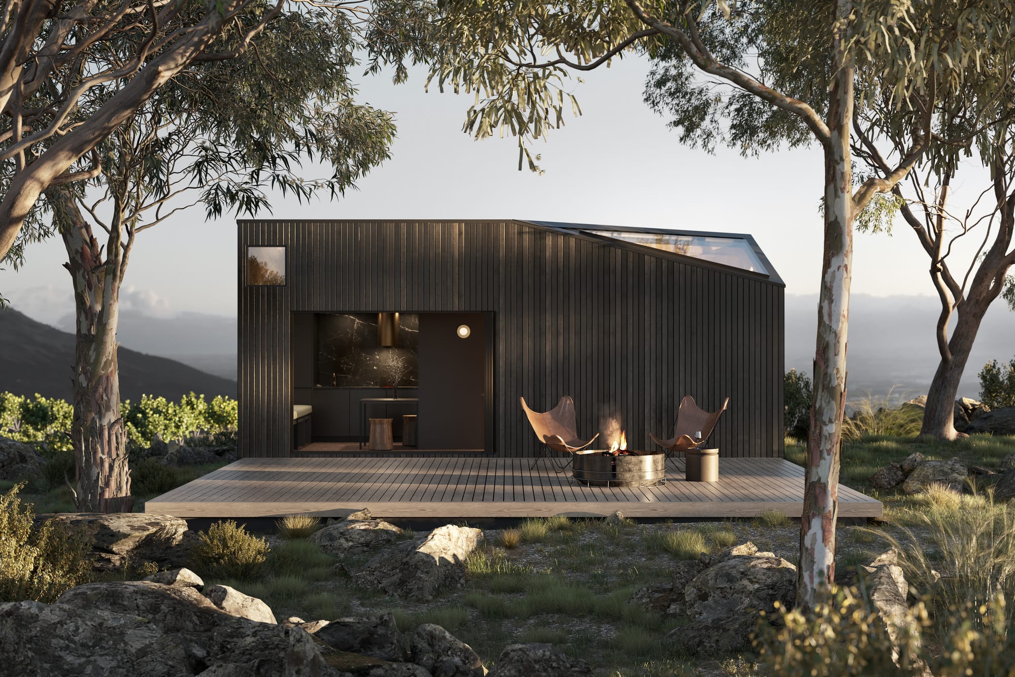 The Chamberlain by Base Cabin. Tiny house exterior integrated in nature featuring wood panel facade and integrated skylight.