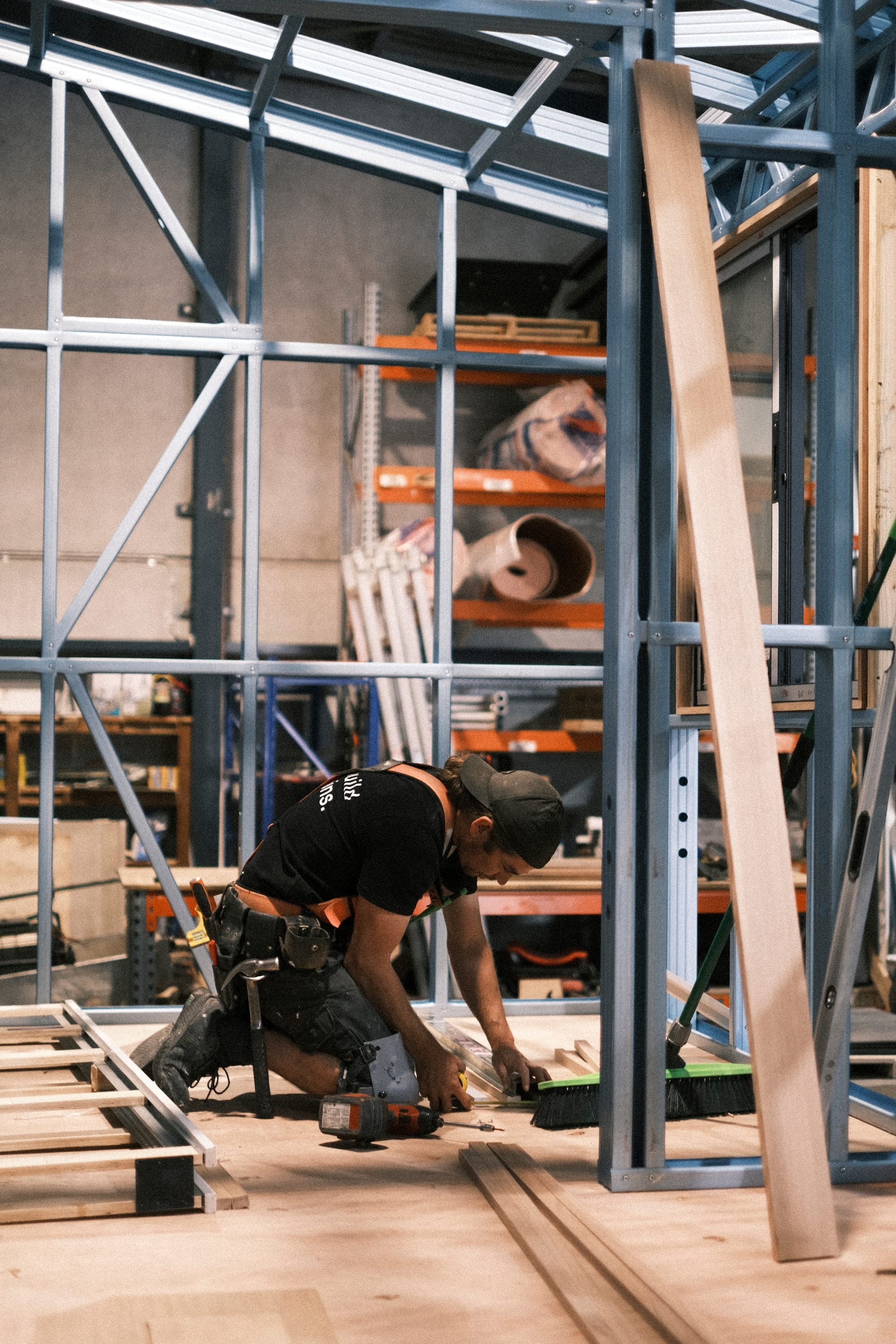 Workshop at Base Cabin. Workshop environment featuring man constructing tiny house.