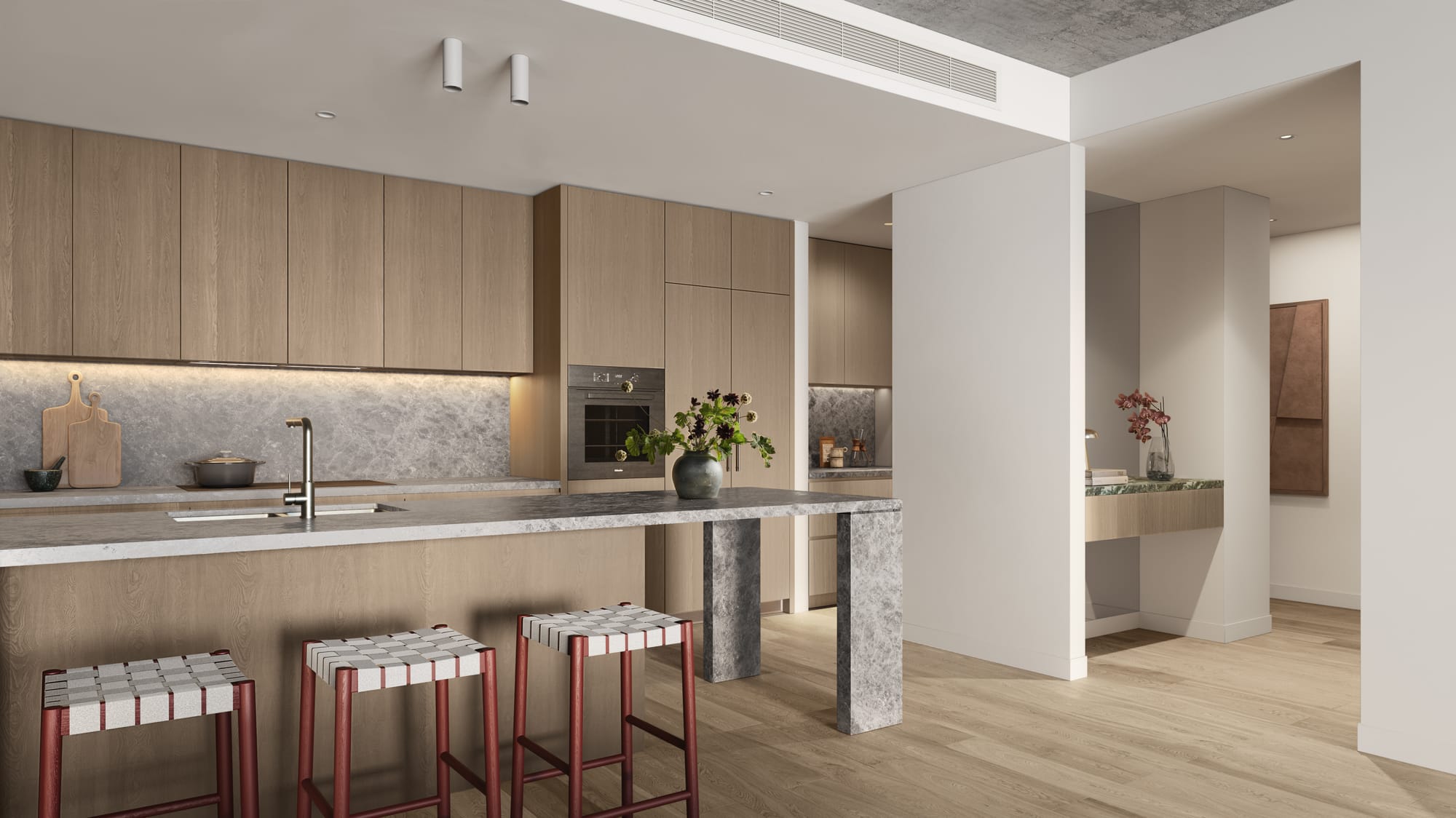 33 Queens Parade by Prime Edition. Modern kitchen featuring wooden fitted cabinet, grey marble kitchen island and concrete ceiling.