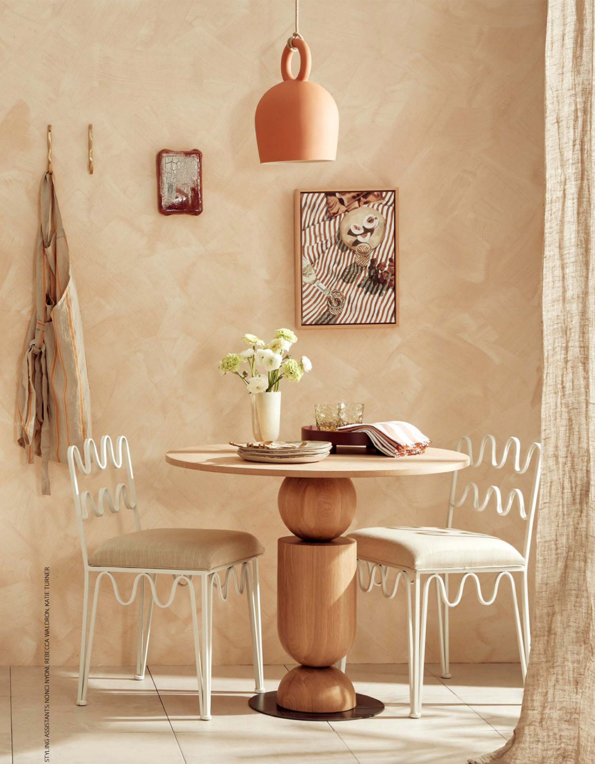 Calo Pendant Light by Klaylife with Lighterior. Dining area featuring clay bowl shaped pendant light, white metal chairs and customised wood table.