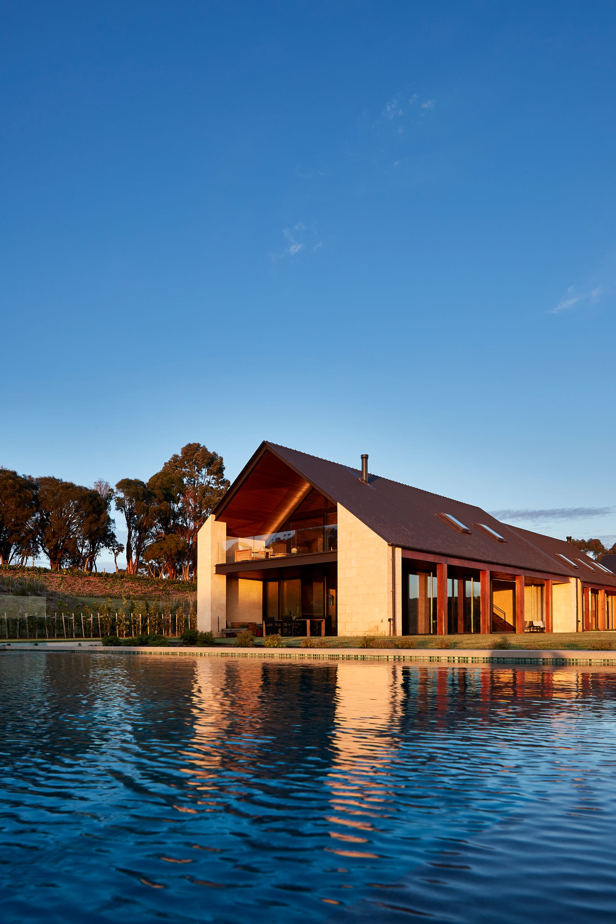 Flinders Residence by Abe McCarthy. Contemporary houses featuring pool, pitched roof, wooden elements