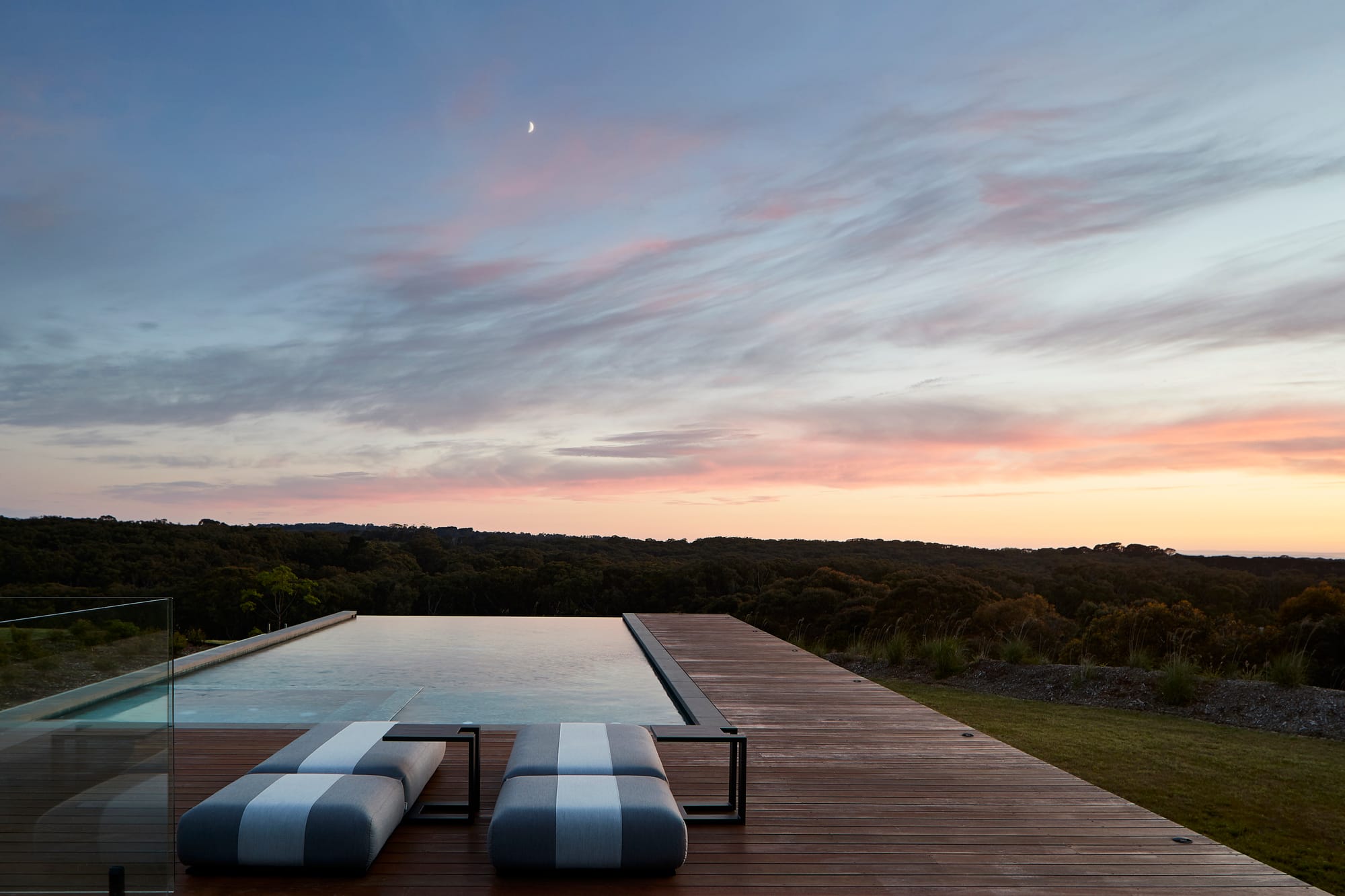 Flinders Residence by Abe McCarthy. Wood panel balcony with integrated pool and view to landscape.