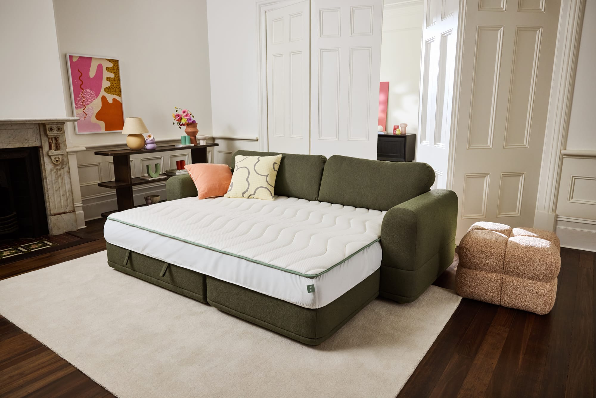 Koala Wanda Sofa Bed in green with it folded out showing the Koala mattress