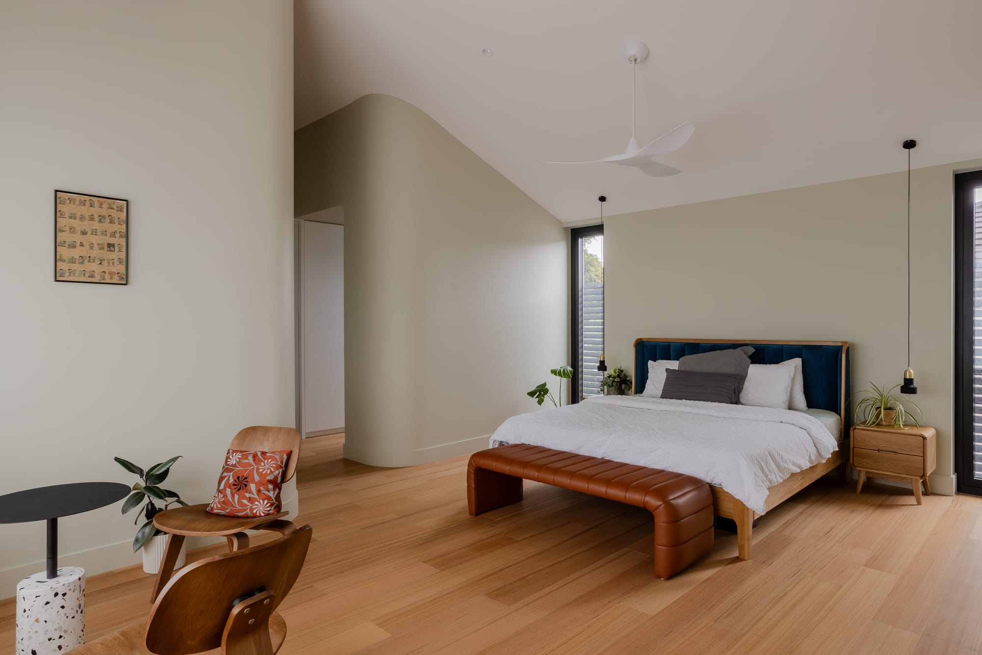 Mahogany House by R Architecture. Modern master bedroom featuring seating area and ensuite bathroom.