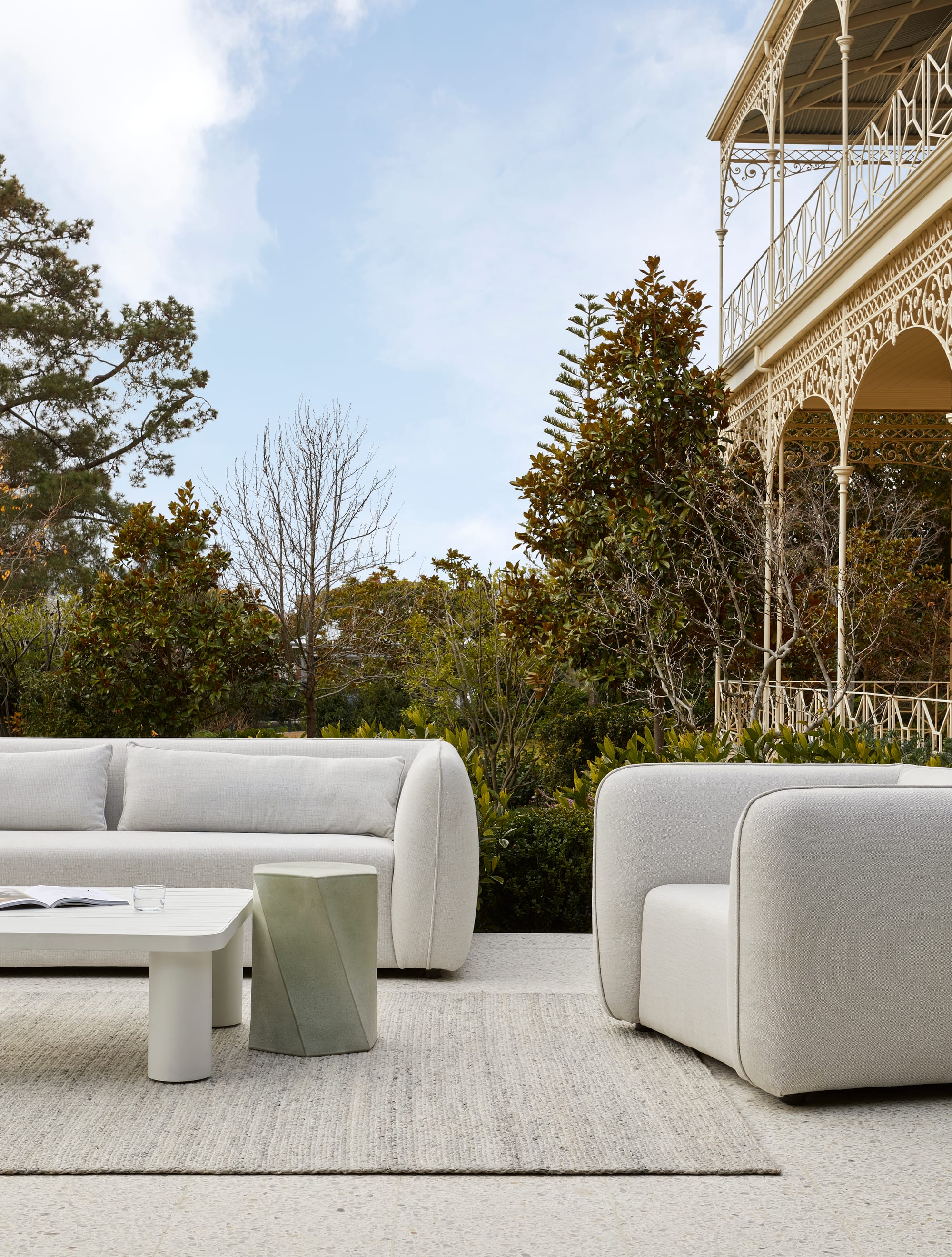 Melba Outdoor Sofa by GlobeWest. Terracce featuring modern round shaped light gray sofa and lounge chair featuring coffee tables.