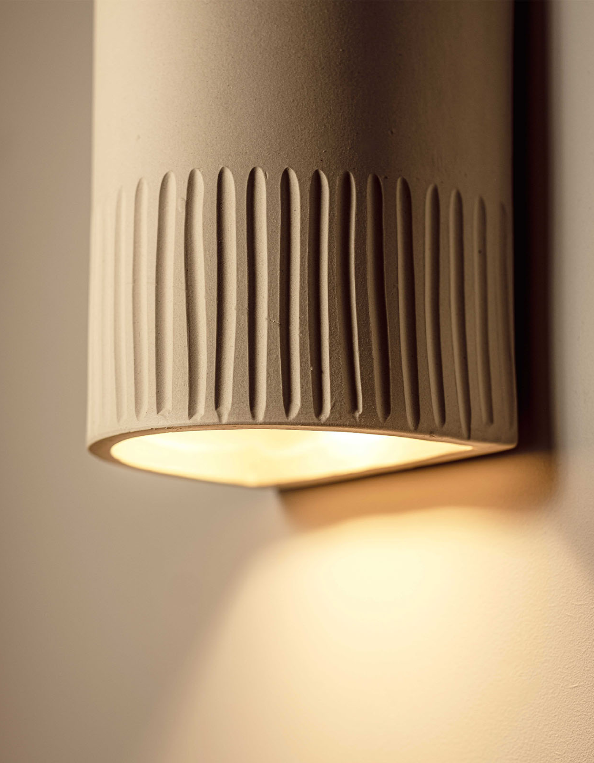 Stone Ceramic Wall Light by We Ponder with Lighterior. Ceramic wall light with hand craved details.