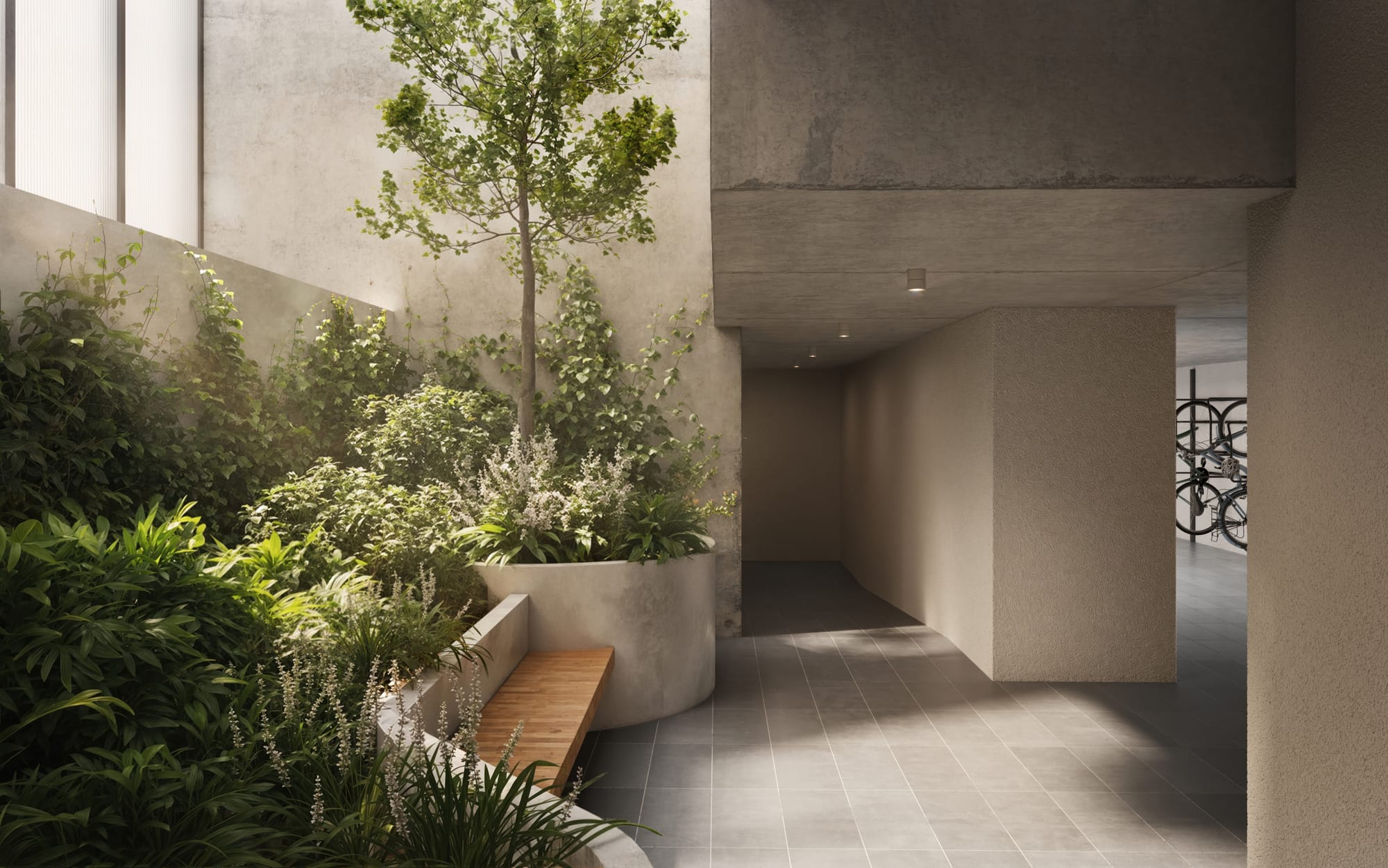 The entry lobby space to 33 Queens Parade showing a lush garden and light streaming in from a high window