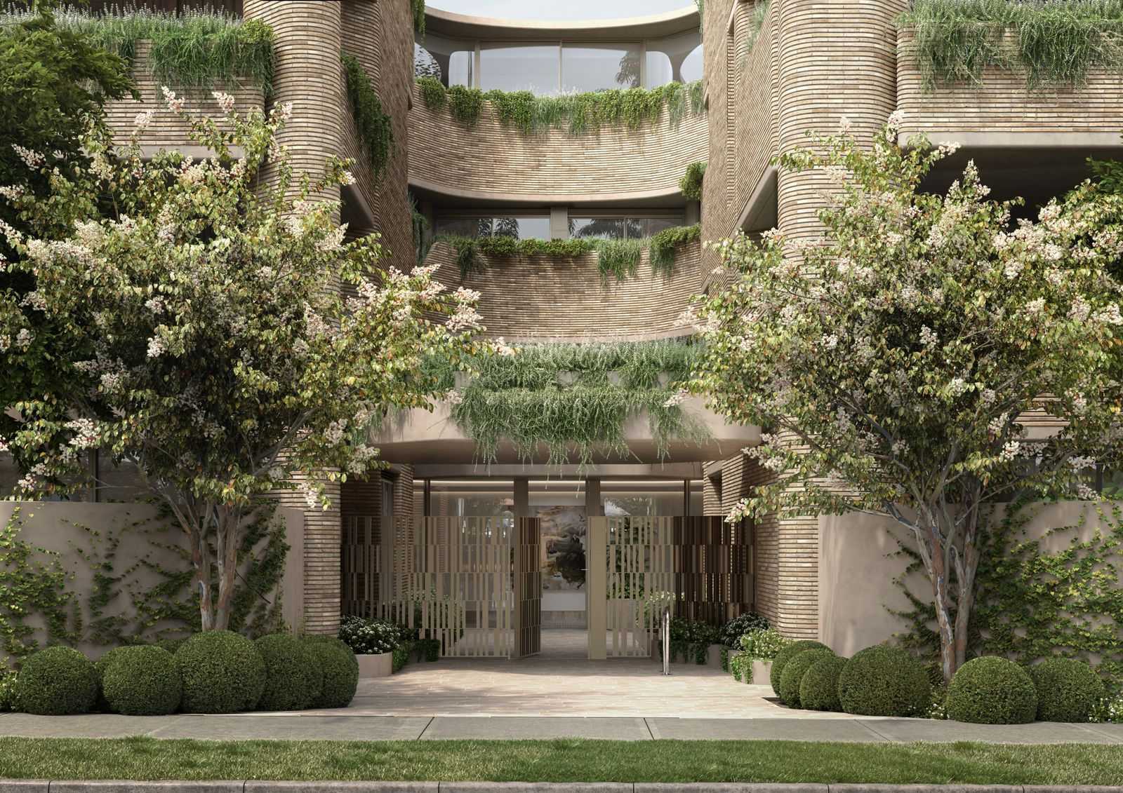 An external render of the entry space at Como Toorak showing the brickwork and lush greenery.