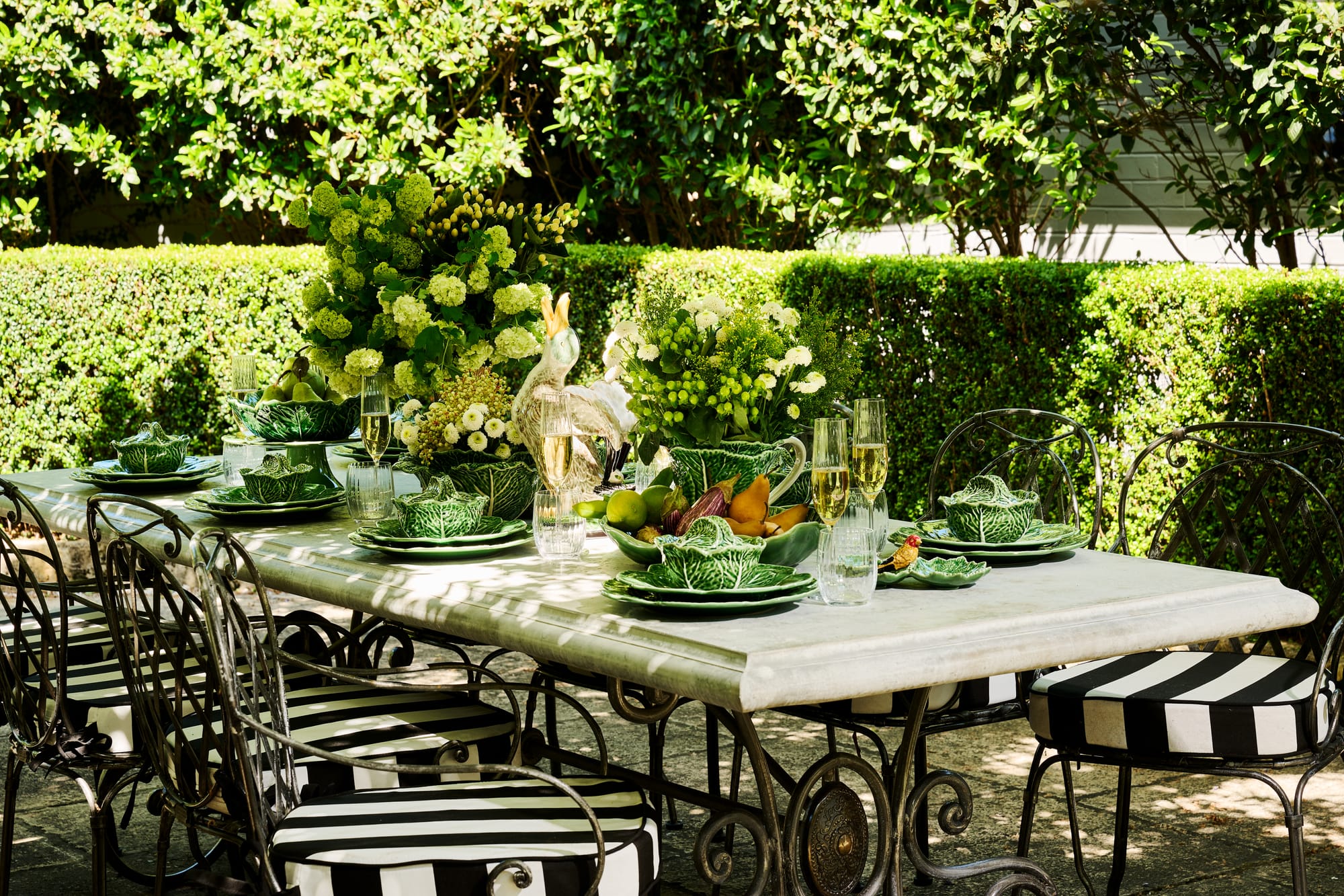 Le Forge Collection Napoli Chairs and Positano Ceramics by Trilogy. Outdoor dining set featuring hand painted ceramics.