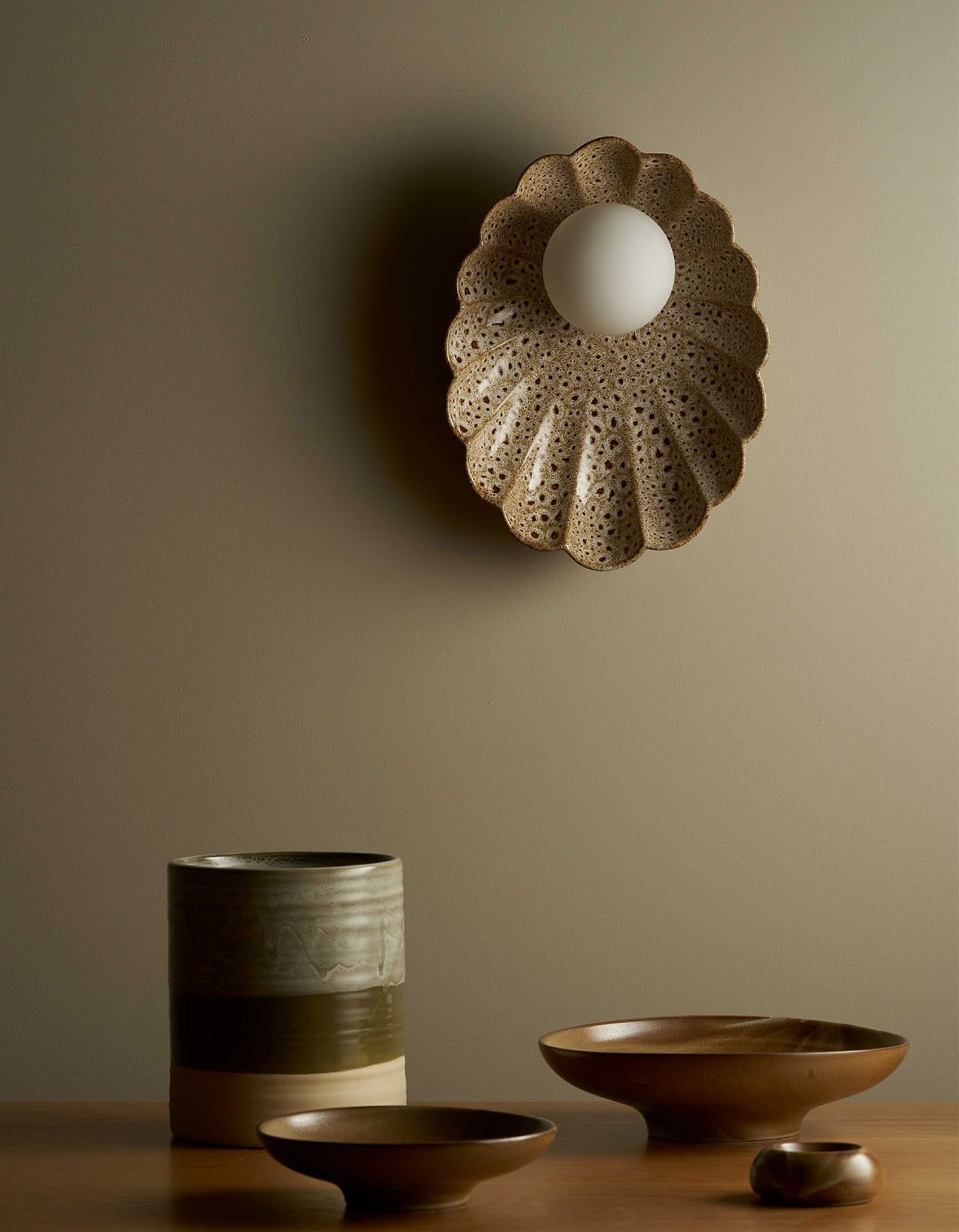 Oyster Wall Light by by Robert Gordon with Lighterior. Oyster shaped wall light featuring ceramic pottery.