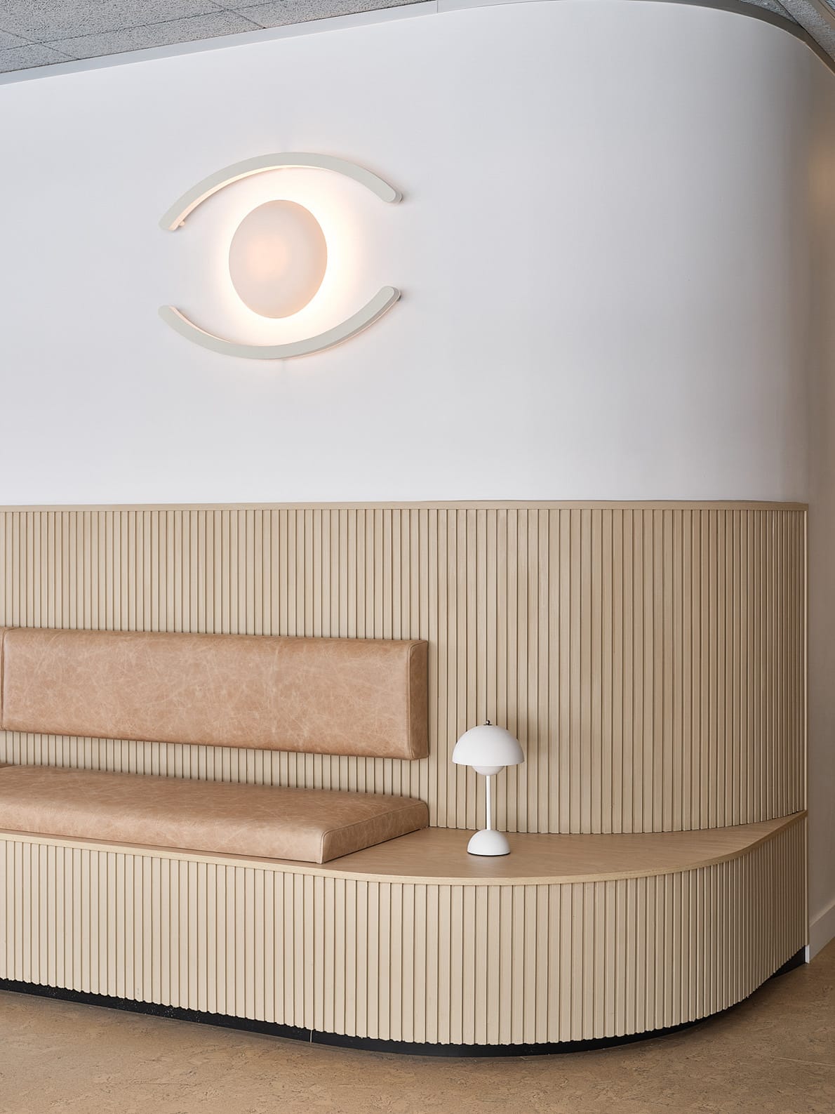 Large Eclipse Sconce by Studio Enti in a dentist office.