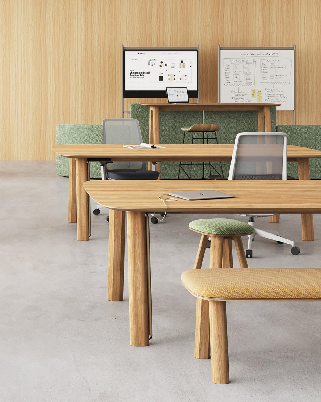 Bazar Table by UFOU. Timber work desks with bench and stool seating options in office space with concrete floors and timber panelled walls. 