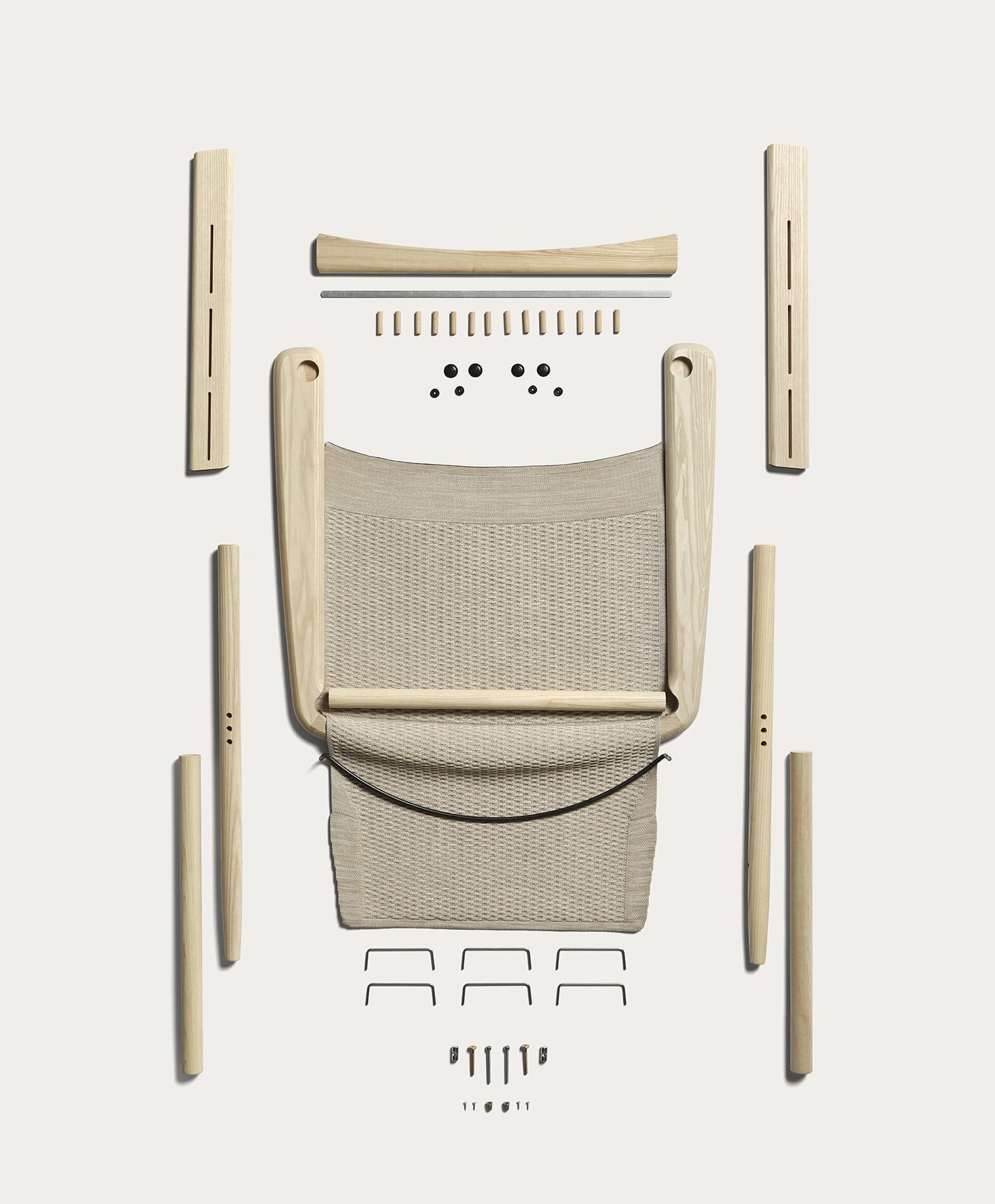 Evo Chair by EFG. Deconstructed timber and knit chair from aerial view on white background. 