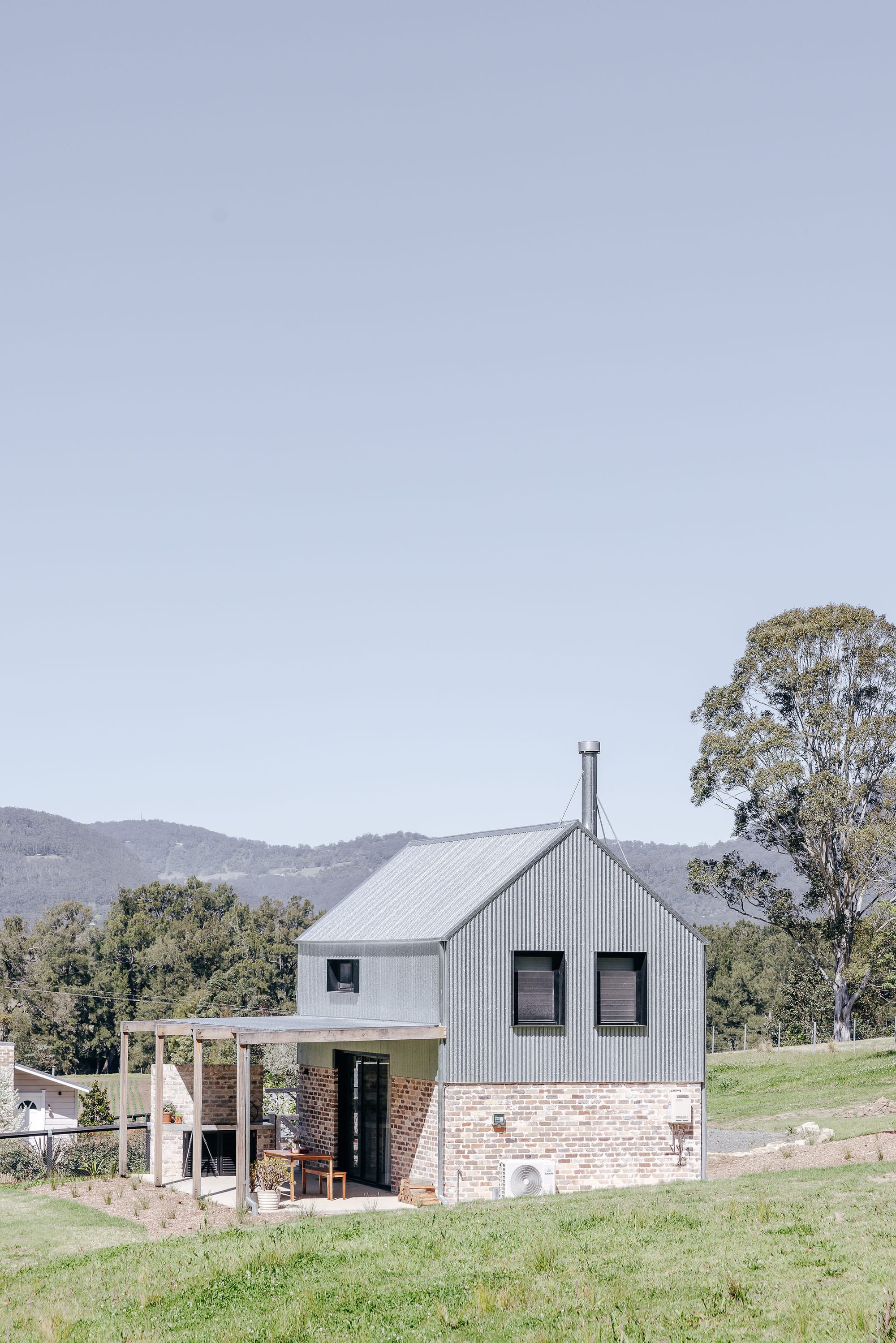 An exterior shot of Hide and Seek Kangaroo Valley showing the metal cladding of Nido.