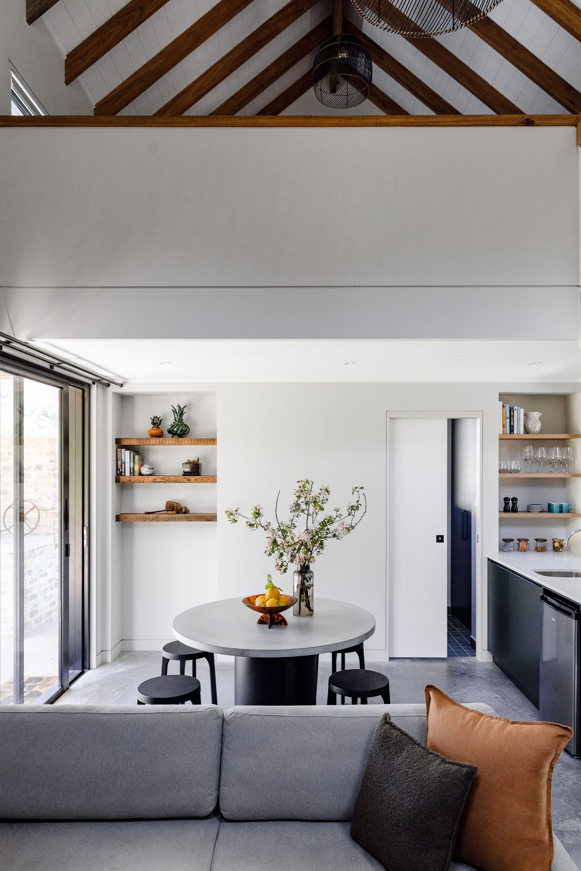 An interior shot of the Nido cabin at Hide and Seek Kangaroo Valley showing the round dining table.