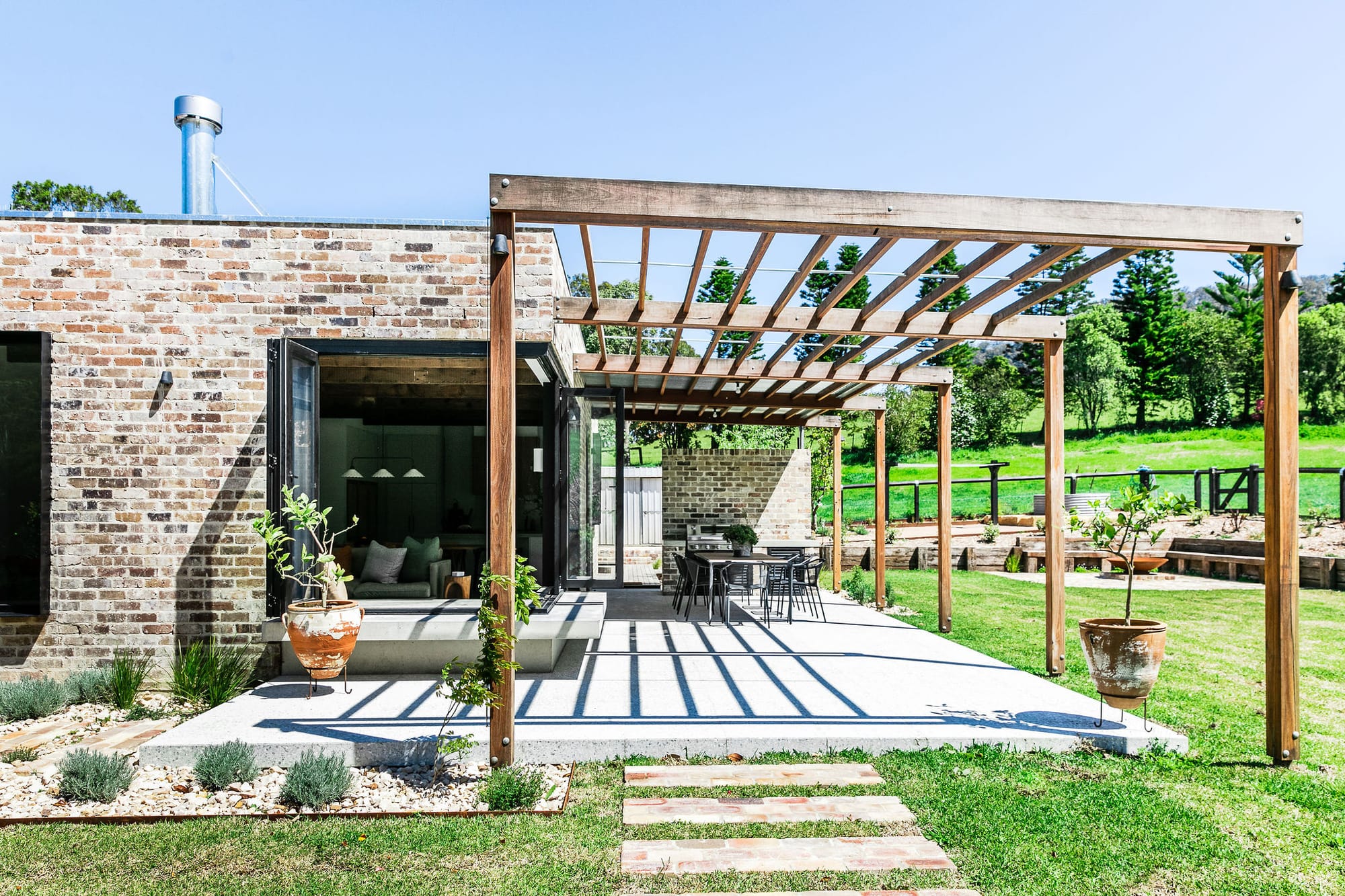 An exterior shot showing the outdoor space and the recycled brickwork used.