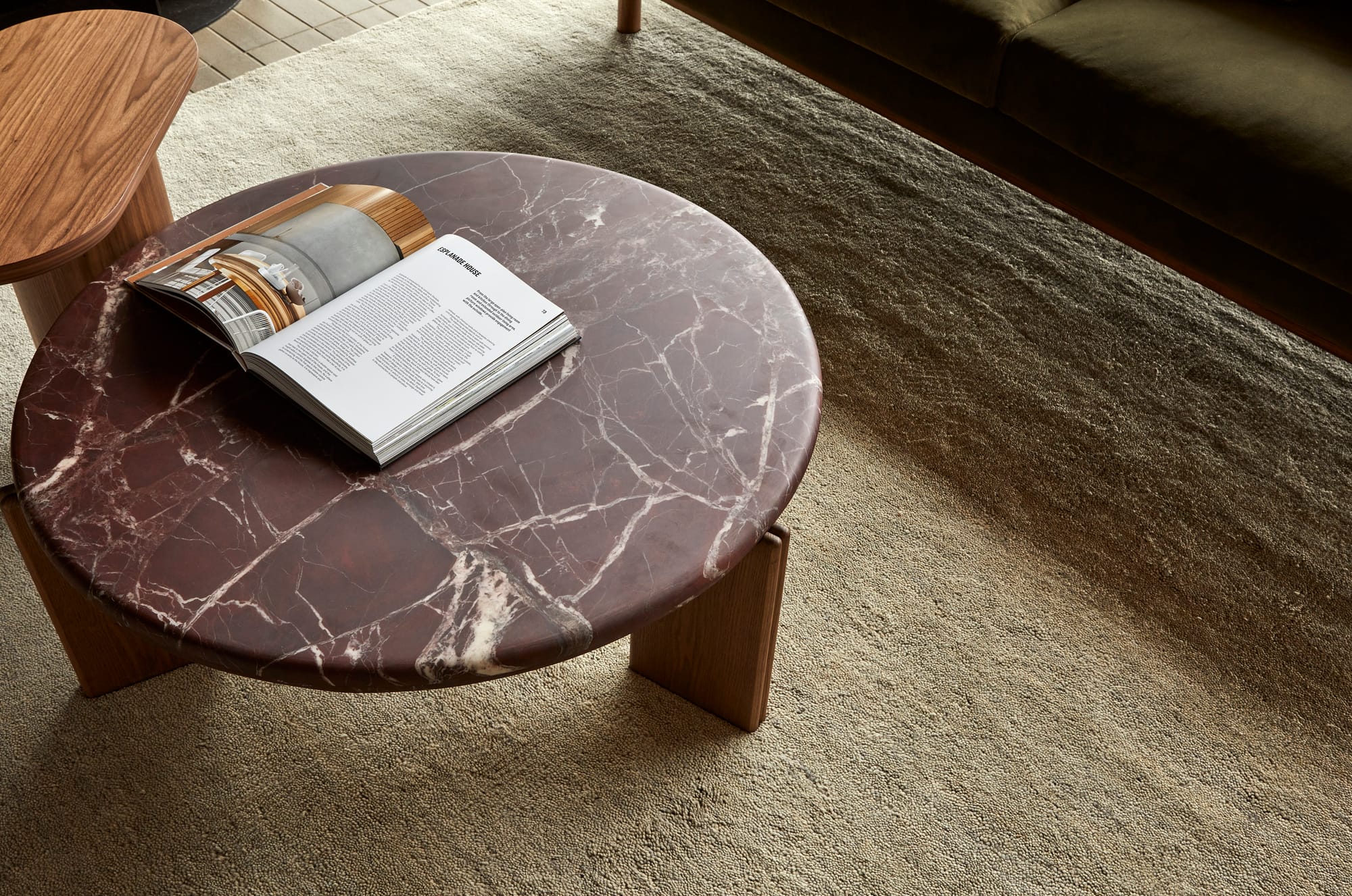 Ray by GlobeWest from Collection 2025. Brown marbled round coffee table on cream rug.