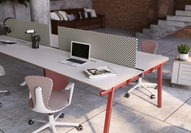 Torii Workstation by UFOU. White work desk with red angled legs, white and red chevron printed work chairs and a black and white patterned screen divider.  