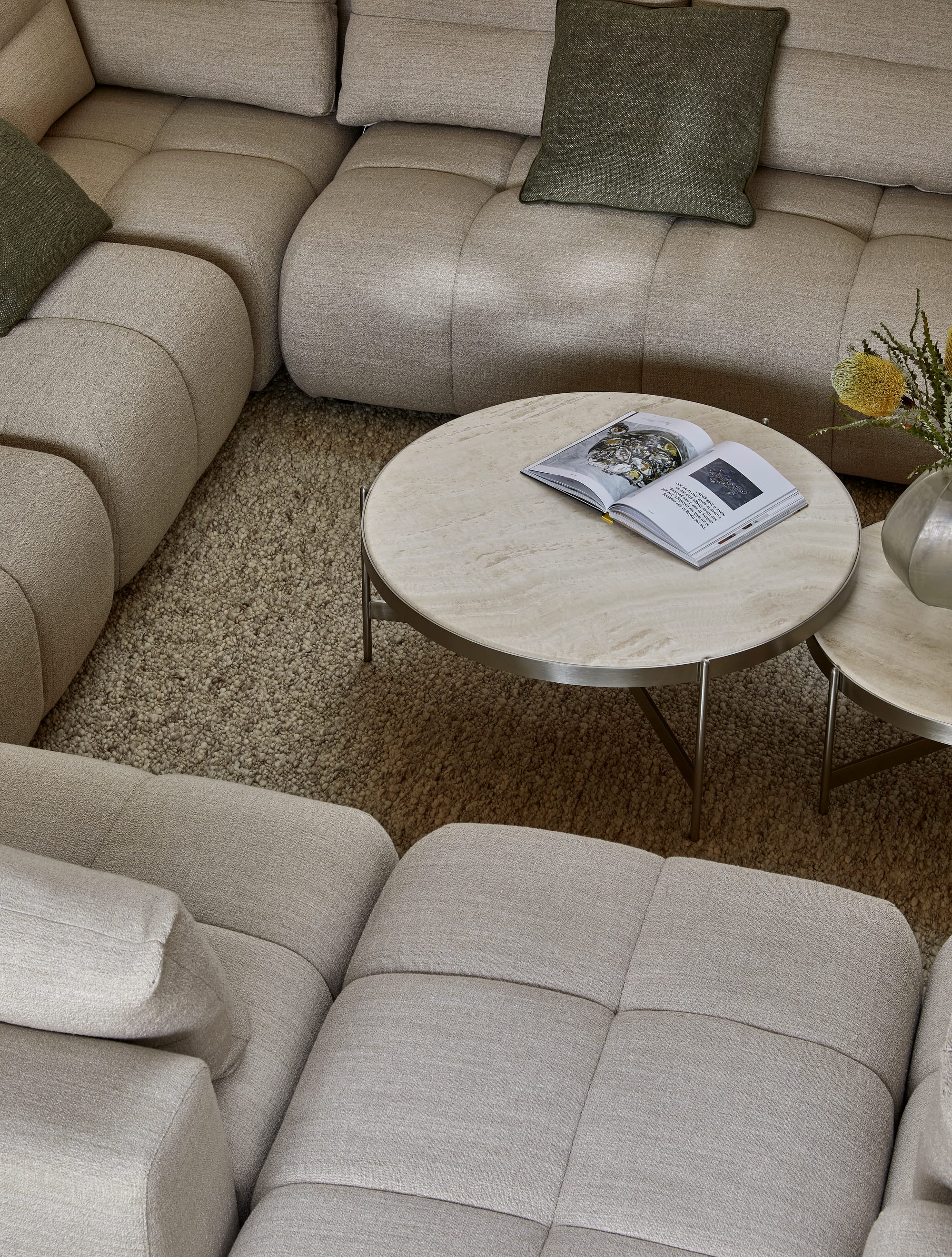 Sidney Tullio by GlobeWest from Collection 2025. Modular grey lounge from above with round stone coffee tables. 