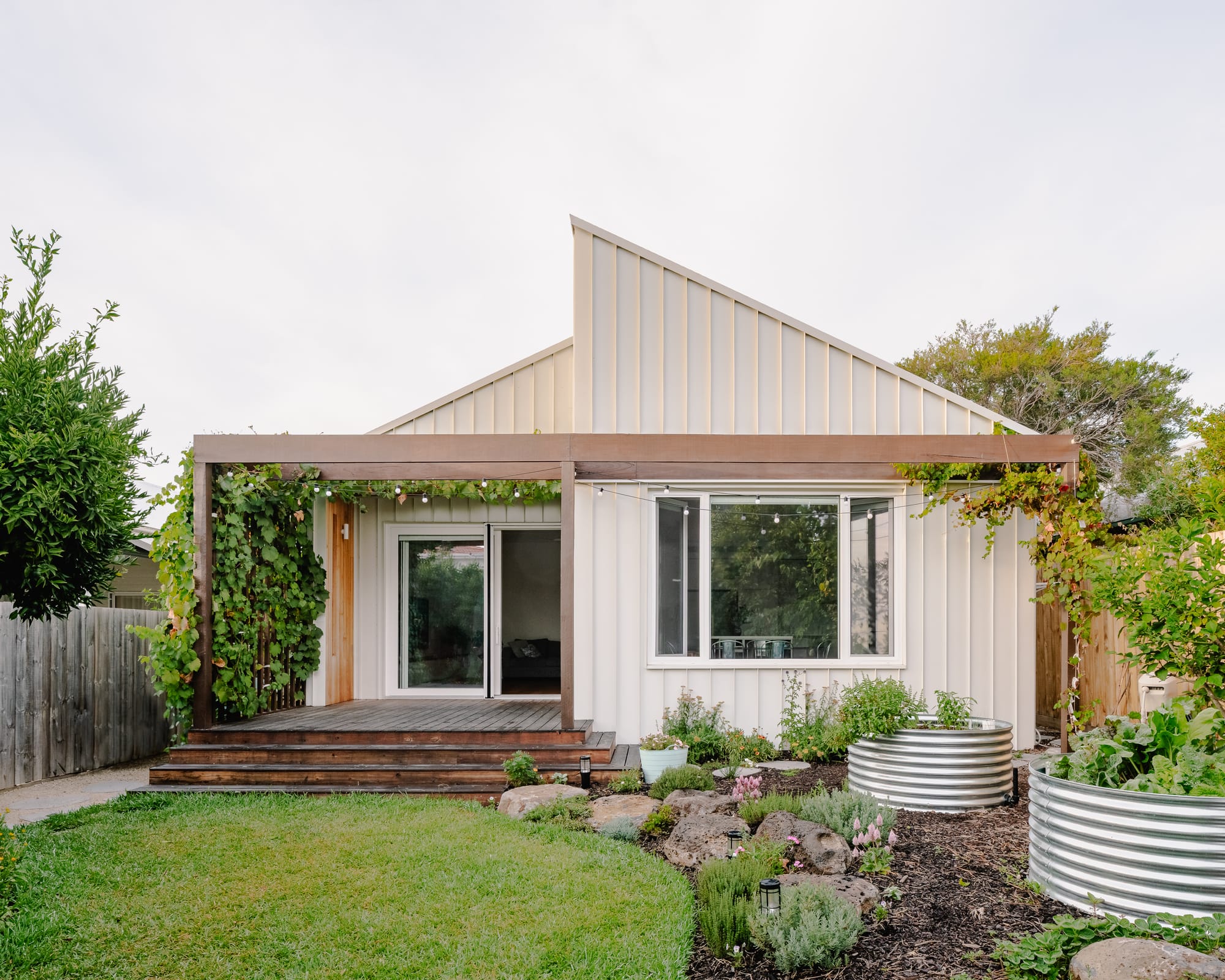 House in Preston by Ashley O'Neill Architects showing the exterior of the house renovation and garden.